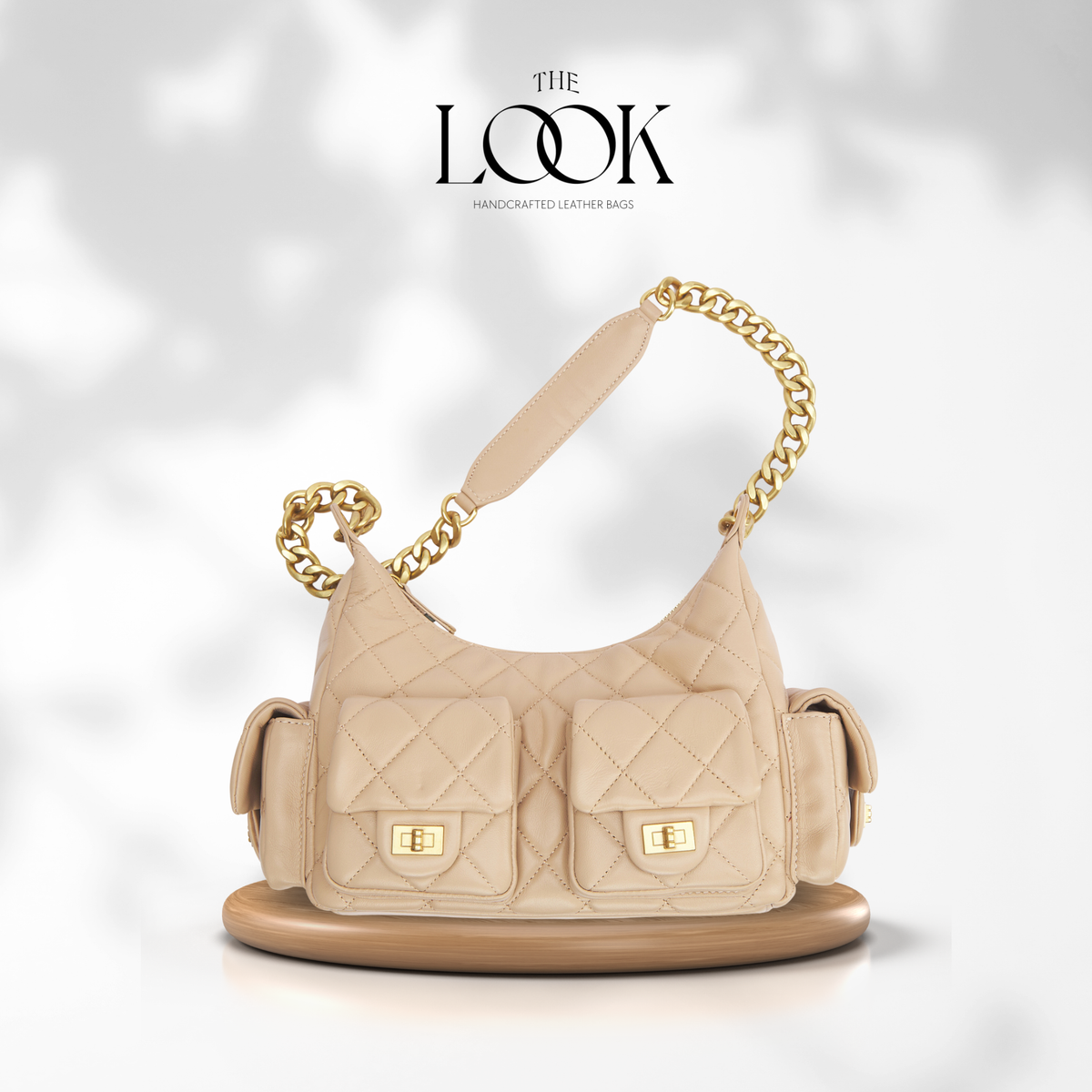 The Quilte Small Multipocket Shoulder Bag — quilted genuine leather, alternate colour interior | The Look Officiel