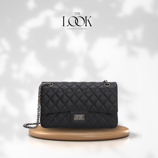 The Quilte Small Distressed Convertible Shoulder Bag in black quilted goatskin leather, front view | The Look Officiel