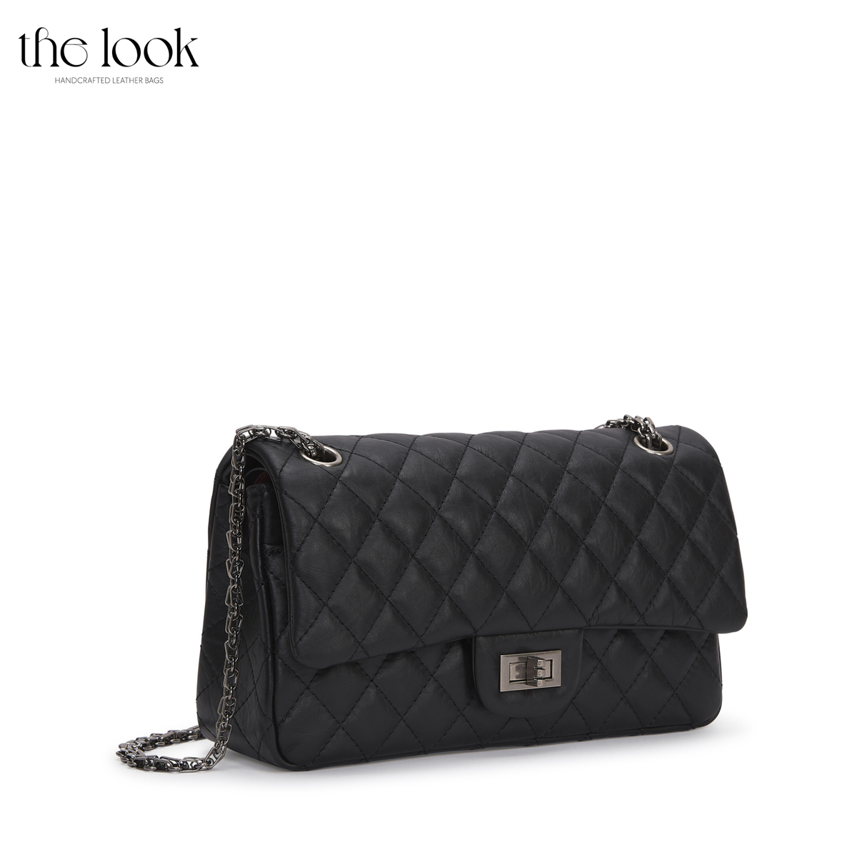 The Quilte Small Distressed Convertible Shoulder Bag in black quilted goatskin leather, angled view | The Look Officiel