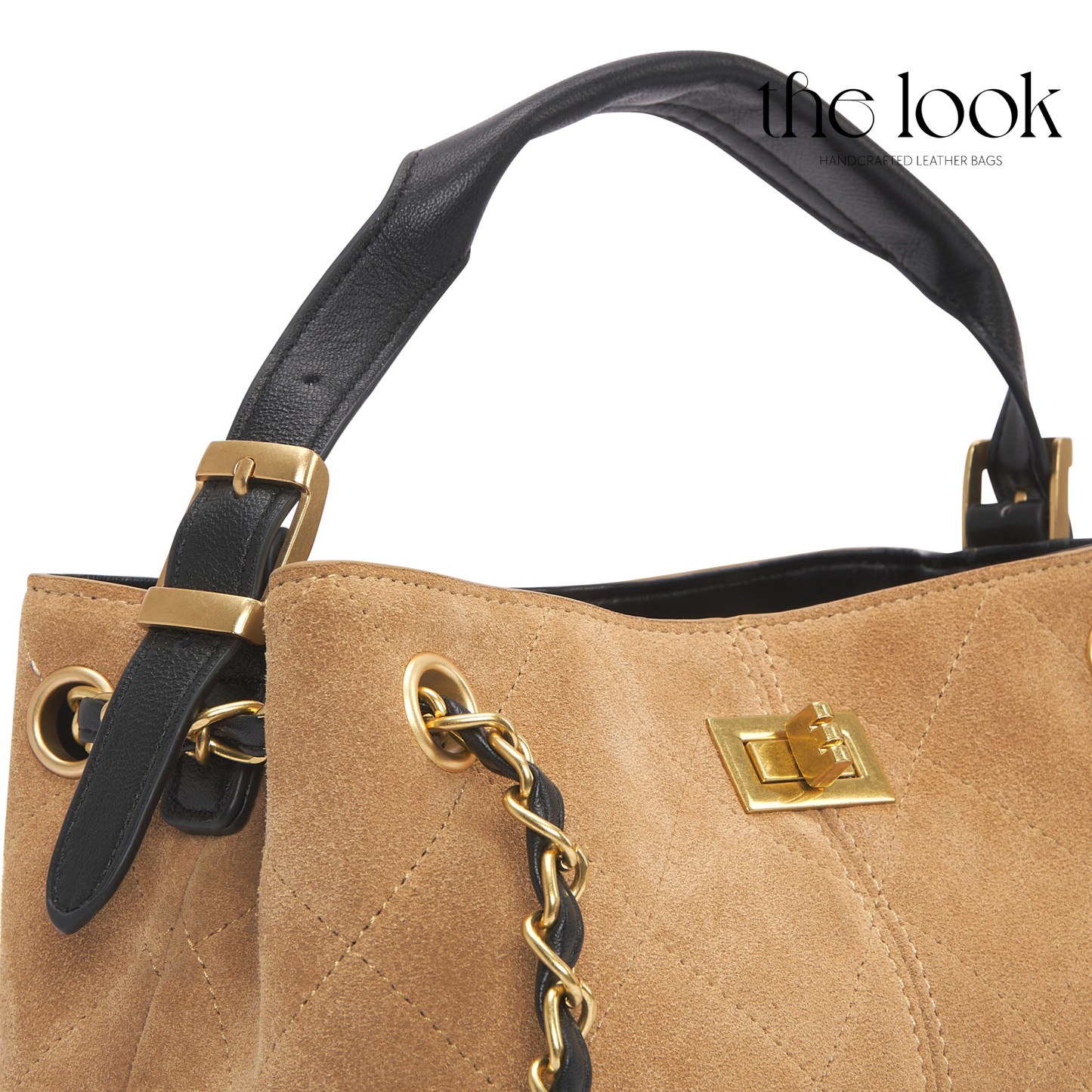 Tan handbag with black handle and gold accents on a white background, featuring 'the look' brand. | The Look Officiel