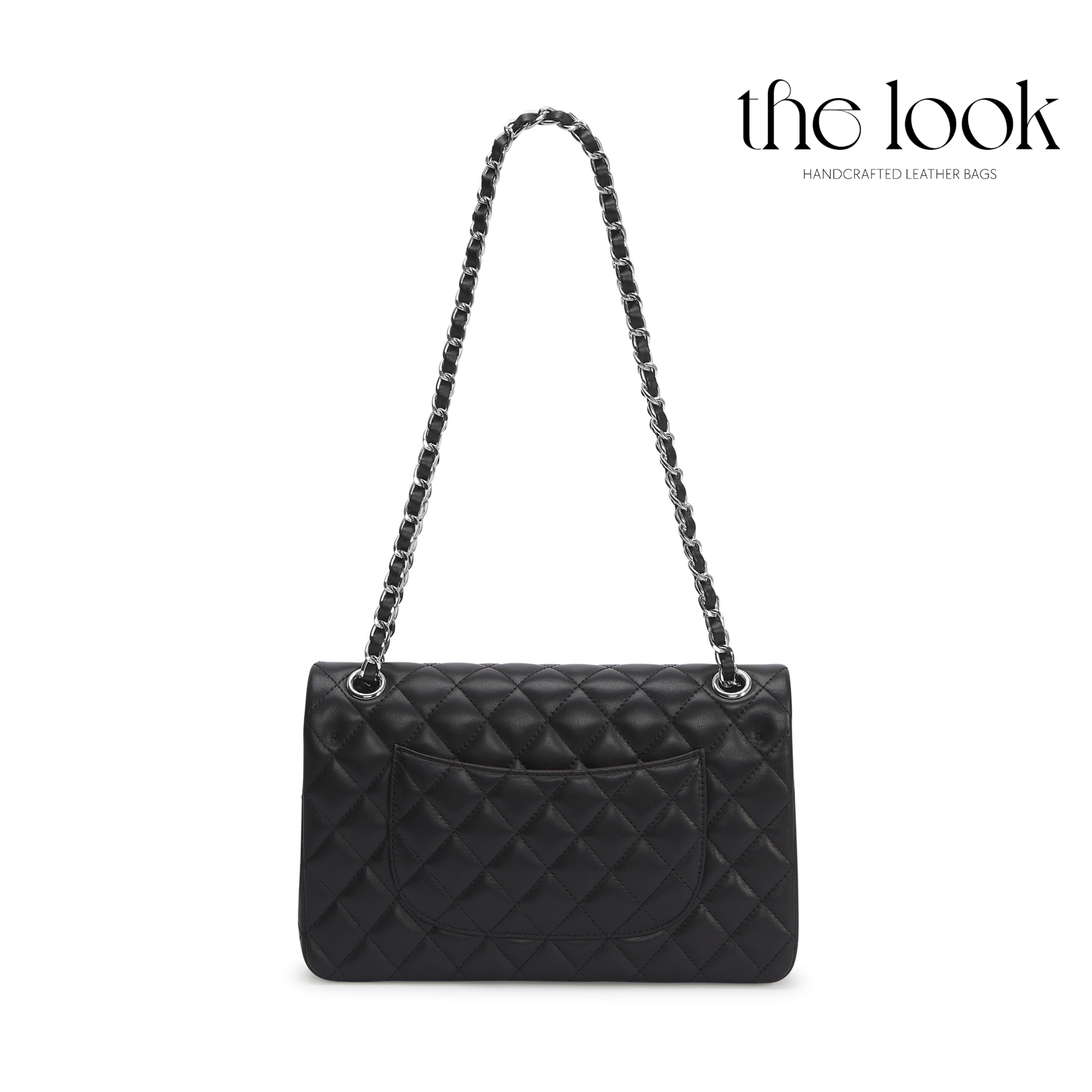 Black quilted handbag with a chain strap on a white background, branded 'the look'. | The Look Officiel