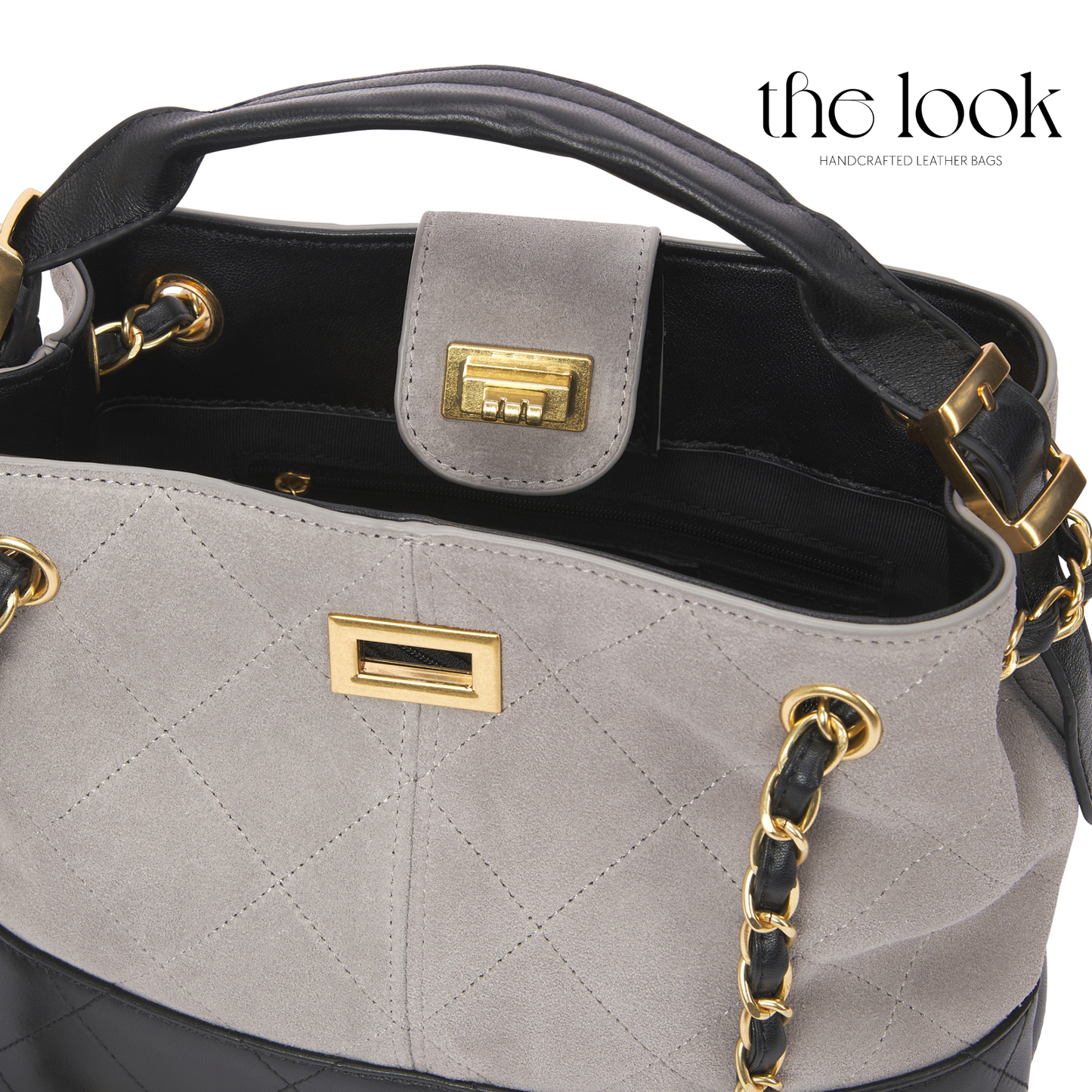Gray handbag with black interior, gold accents, and 'the look' branding. | The Look Officiel