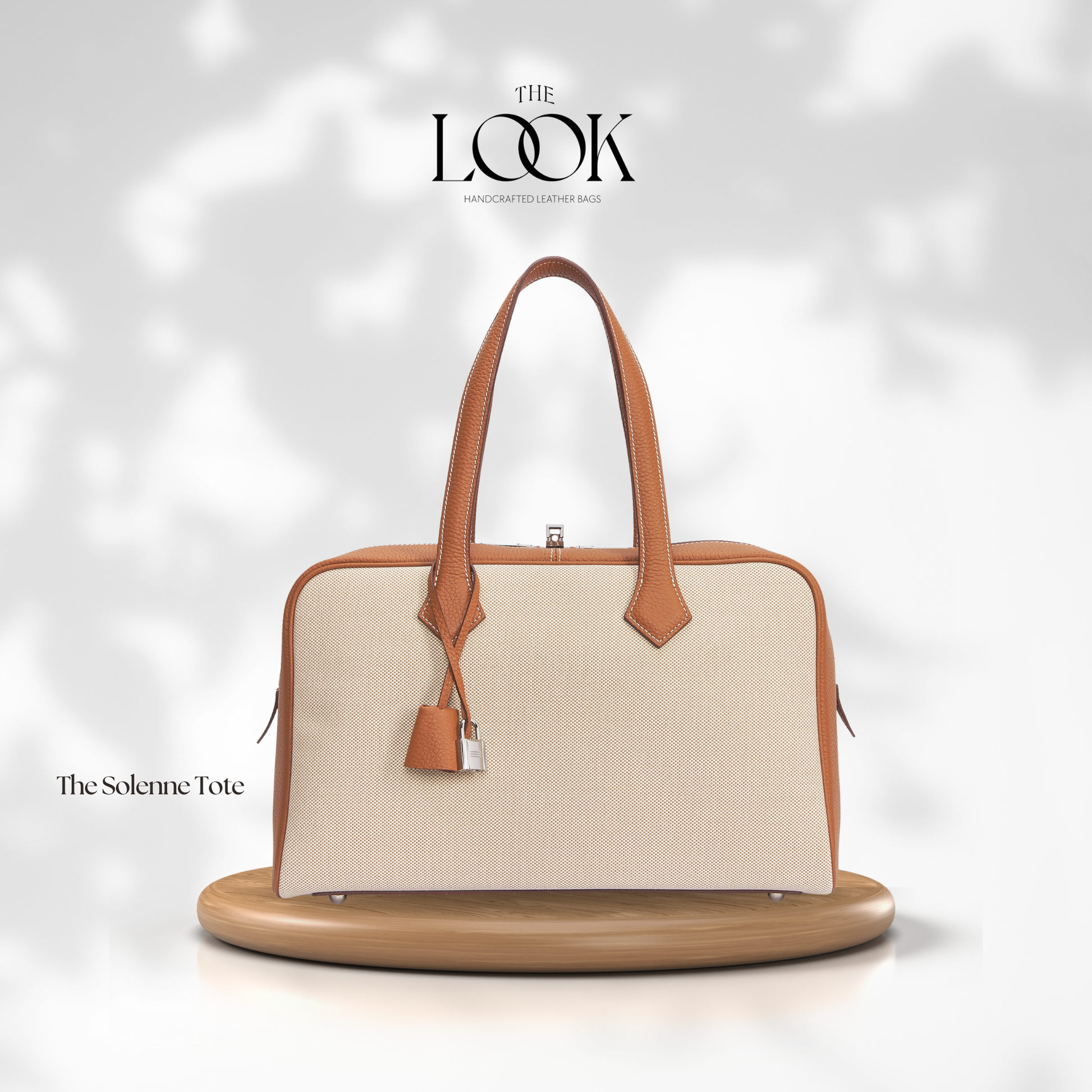 Beige handbag with brown handles and trim on a white background, featuring 'The Look' brand. | The Look Officiel