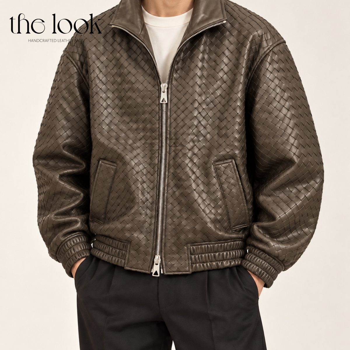 The Loop Weave Bomber Jacket in Etoupe, worn with black trousers