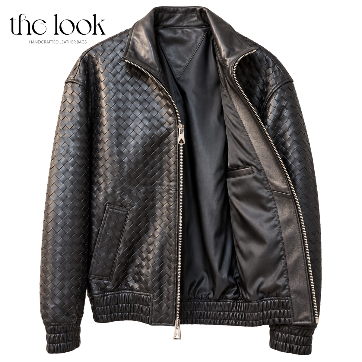 The Loop Weave Bomber Jacket in Black, shown open with interior lining
