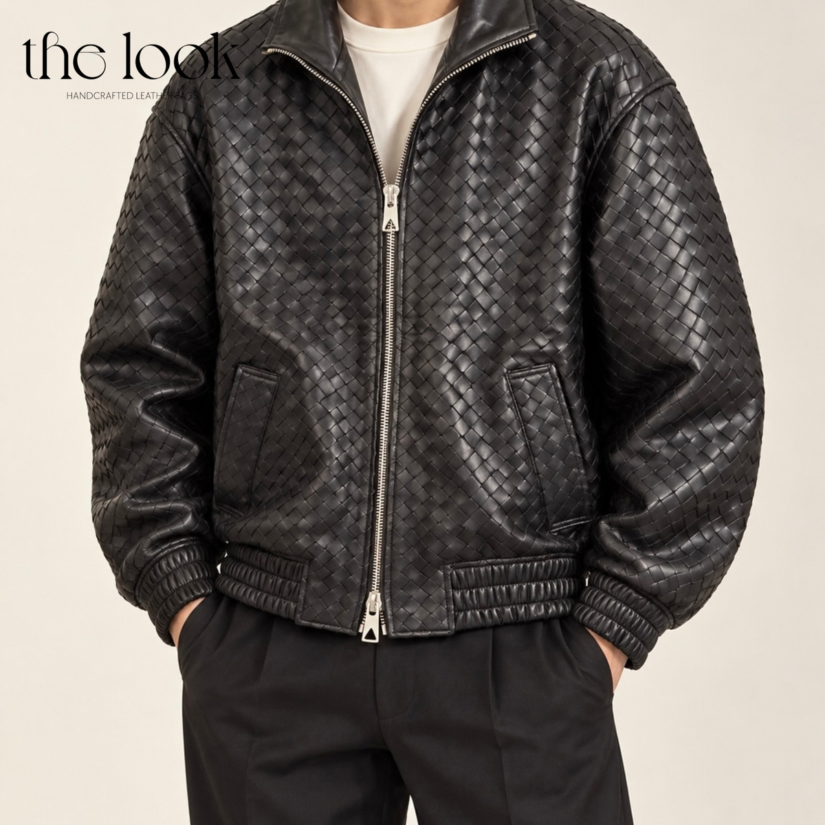 The Loop Weave Bomber Jacket in Black, worn from the front