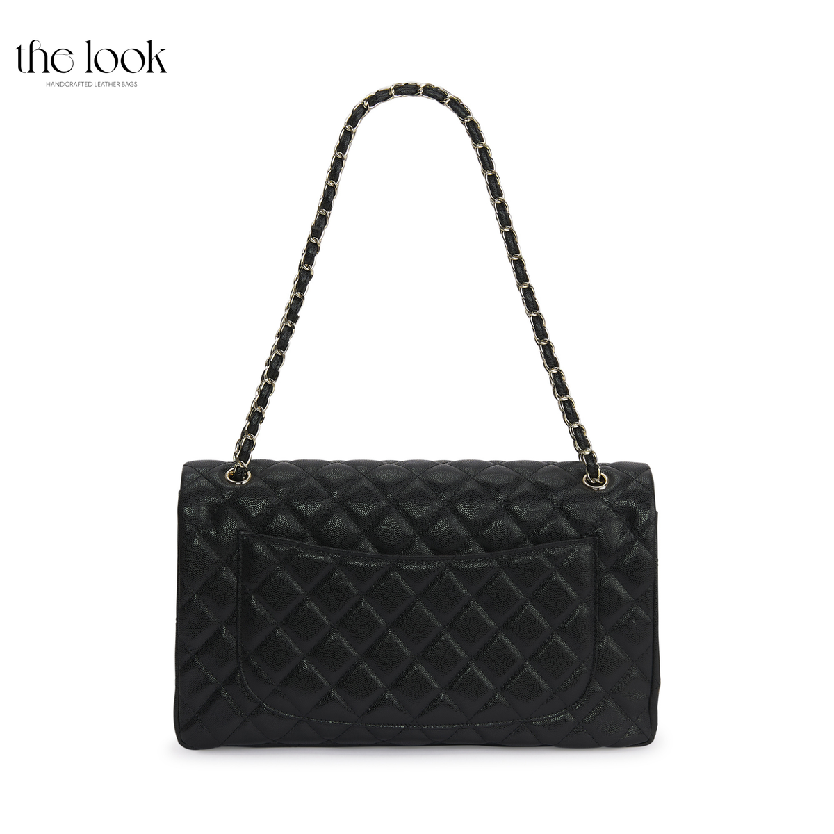 The Quilte Extra Large Convertible Shoulder Bag in Black with chain strap extended, back view | The Look Officiel