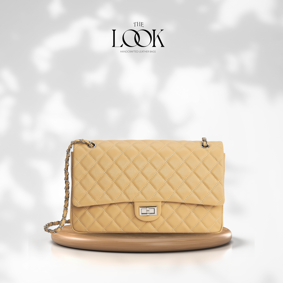 The Quilte Extra Large Convertible Shoulder Bag in Biscuit with silver hardware, front view | The Look Officiel