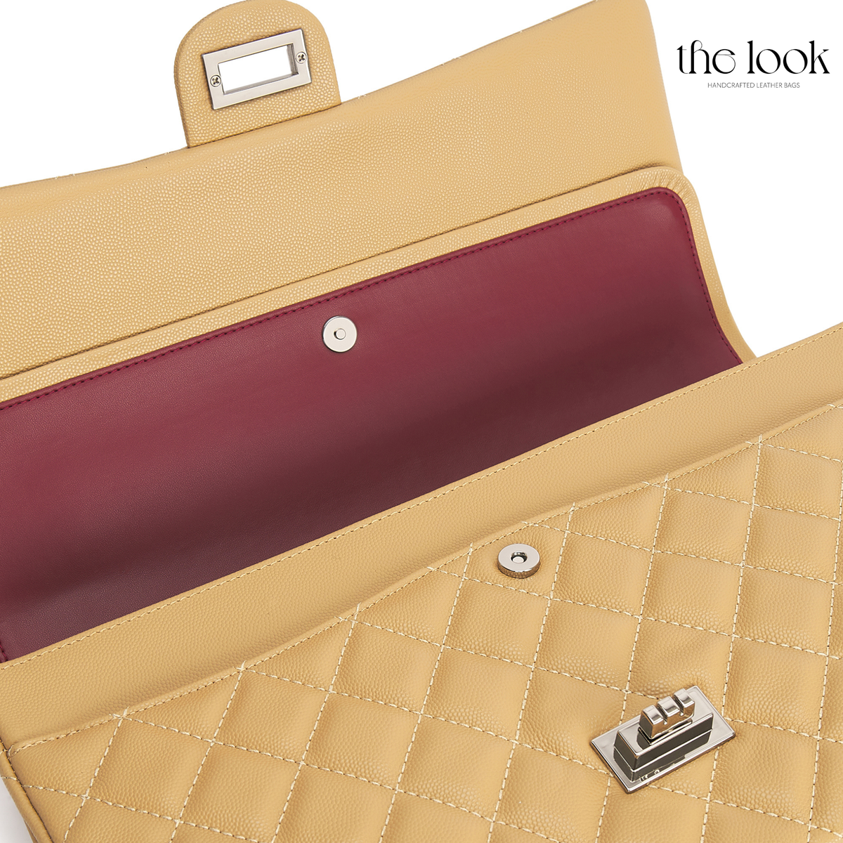 The Quilte Extra Large Convertible Shoulder Bag in Biscuit with open double-flap interior | The Look Officiel