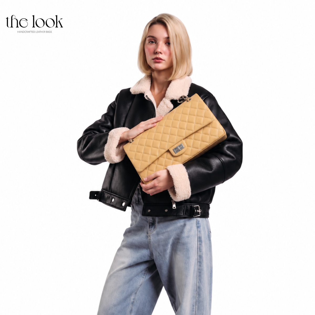 Model holding The Quilte Extra Large Convertible Shoulder Bag in Biscuit | The Look Officiel