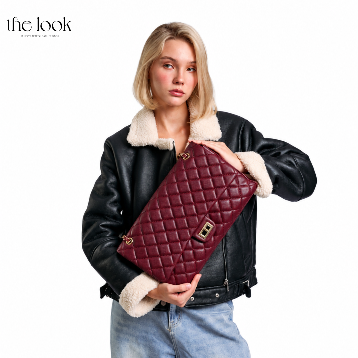 Model holding The Quilte Extra Large Convertible Shoulder Bag in Burgundy | The Look Officiel