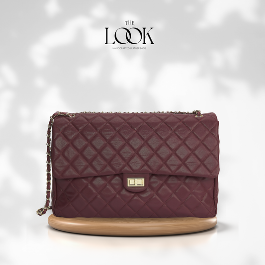 Burgundy The Quilte Jumbo Convertible Travel Bag with silver hardware, front view | The Look Officiel