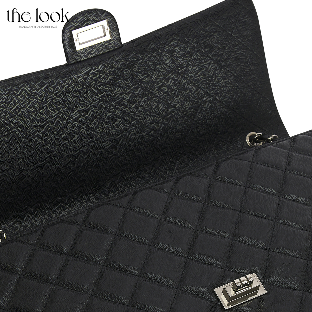 Black The Quilte Jumbo Convertible Travel Bag close-up of quilting and silver twist-lock hardware | The Look Officiel