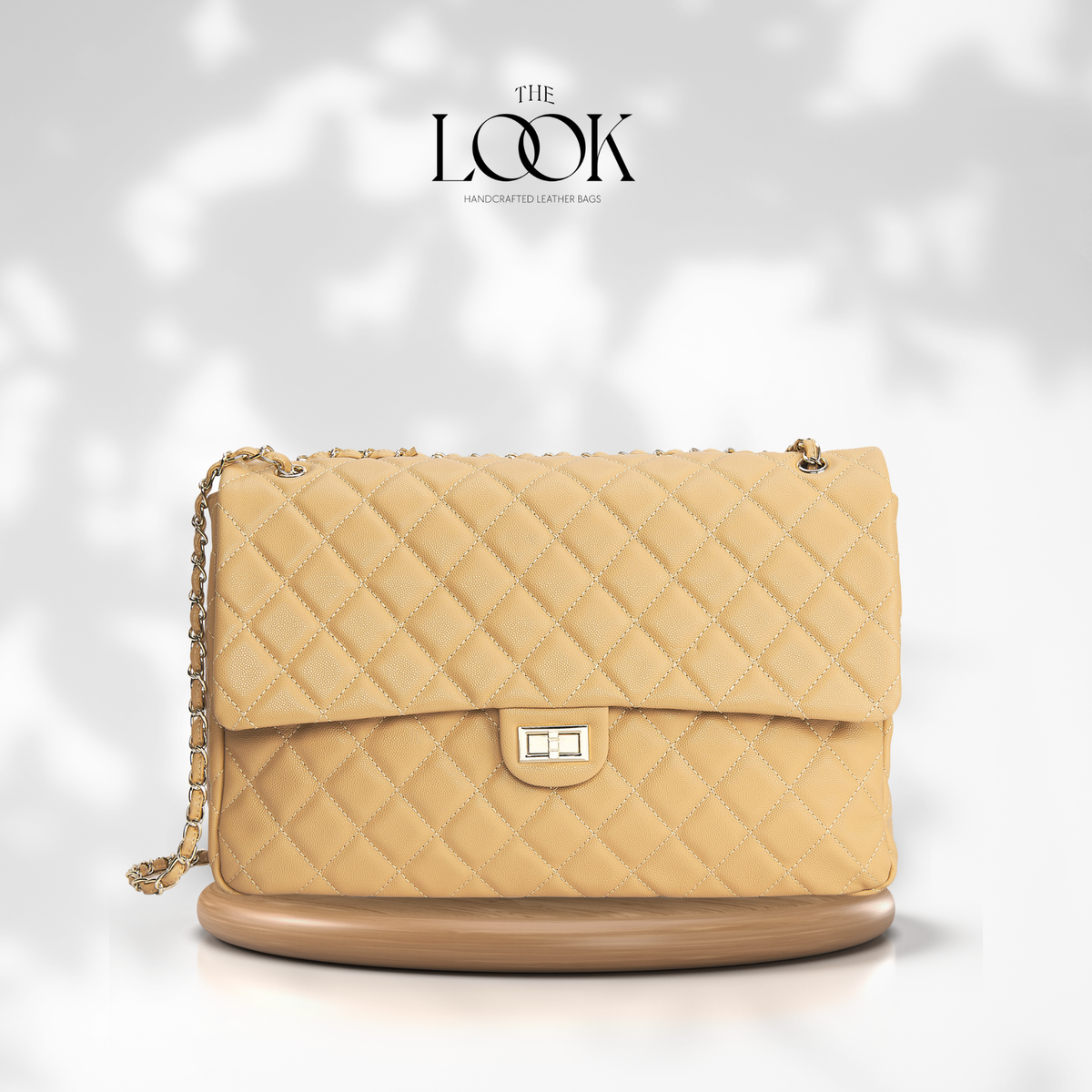Biscuit The Quilte Jumbo Convertible Travel Bag with silver hardware, front view | The Look Officiel