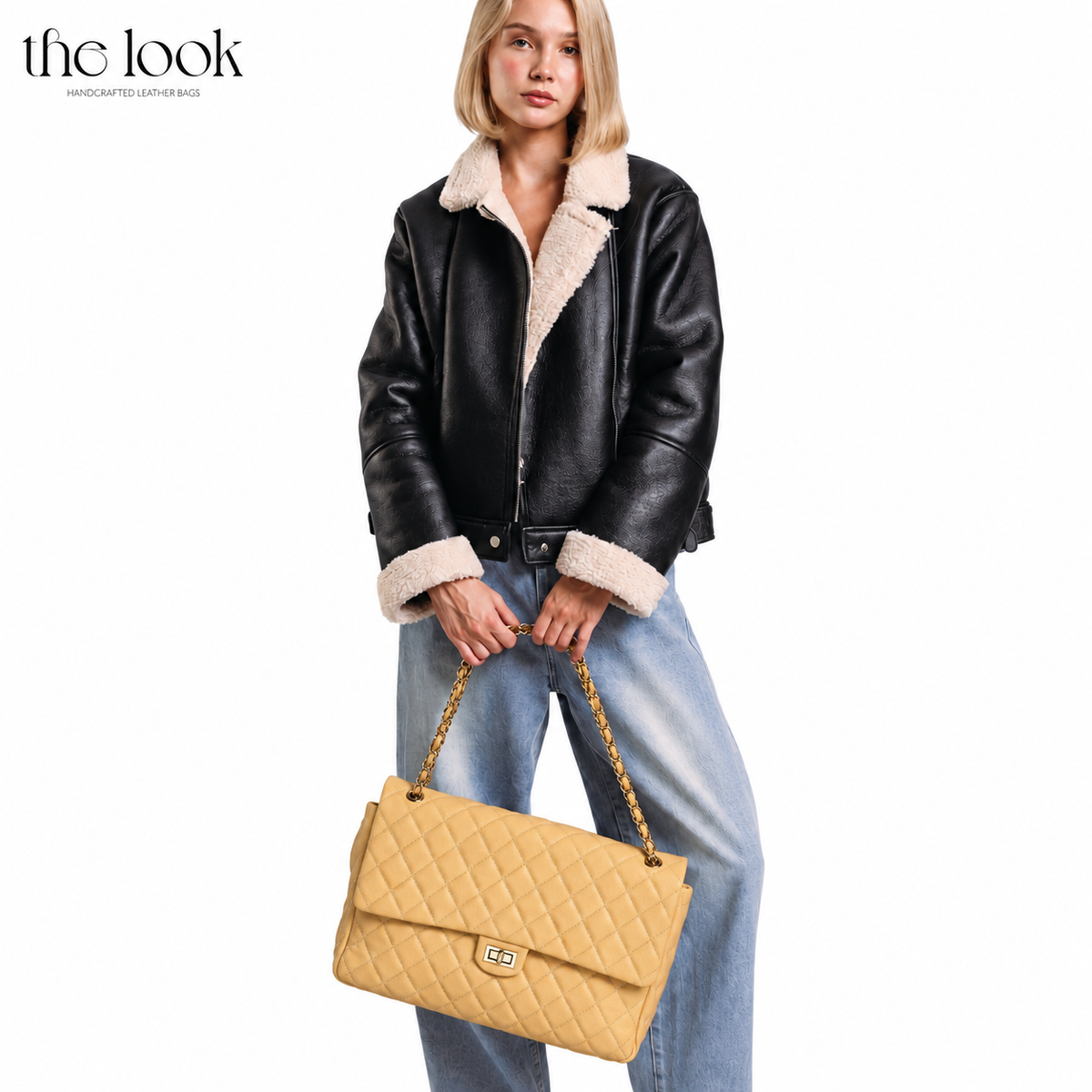 Biscuit The Quilte Jumbo Convertible Travel Bag carried by hand | The Look Officiel