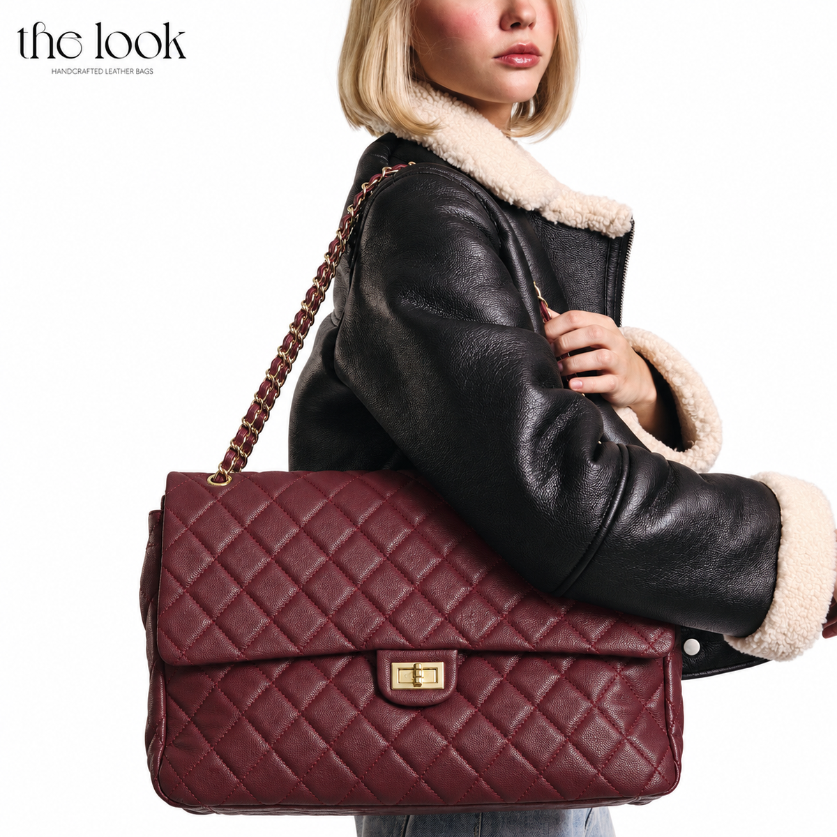 Burgundy The Quilte Jumbo Convertible Travel Bag worn over the shoulder | The Look Officiel