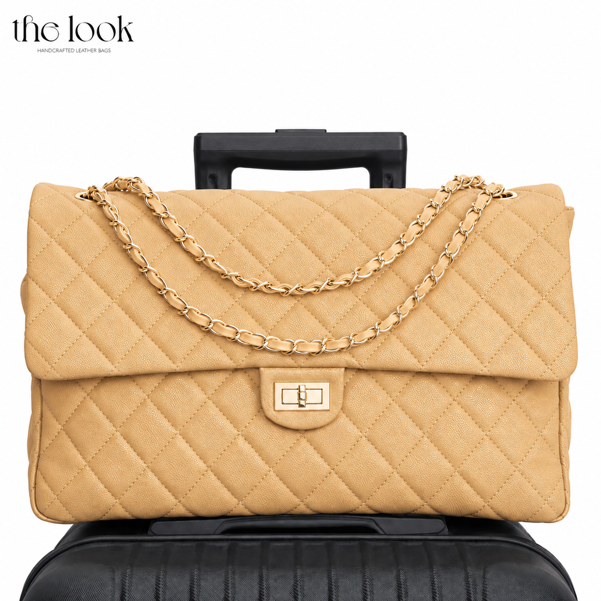 The Quilte Jumbo Convertible Travel Bag in Biscuit caviar calfskin leather on a suitcase with chain strap | The Look Officiel