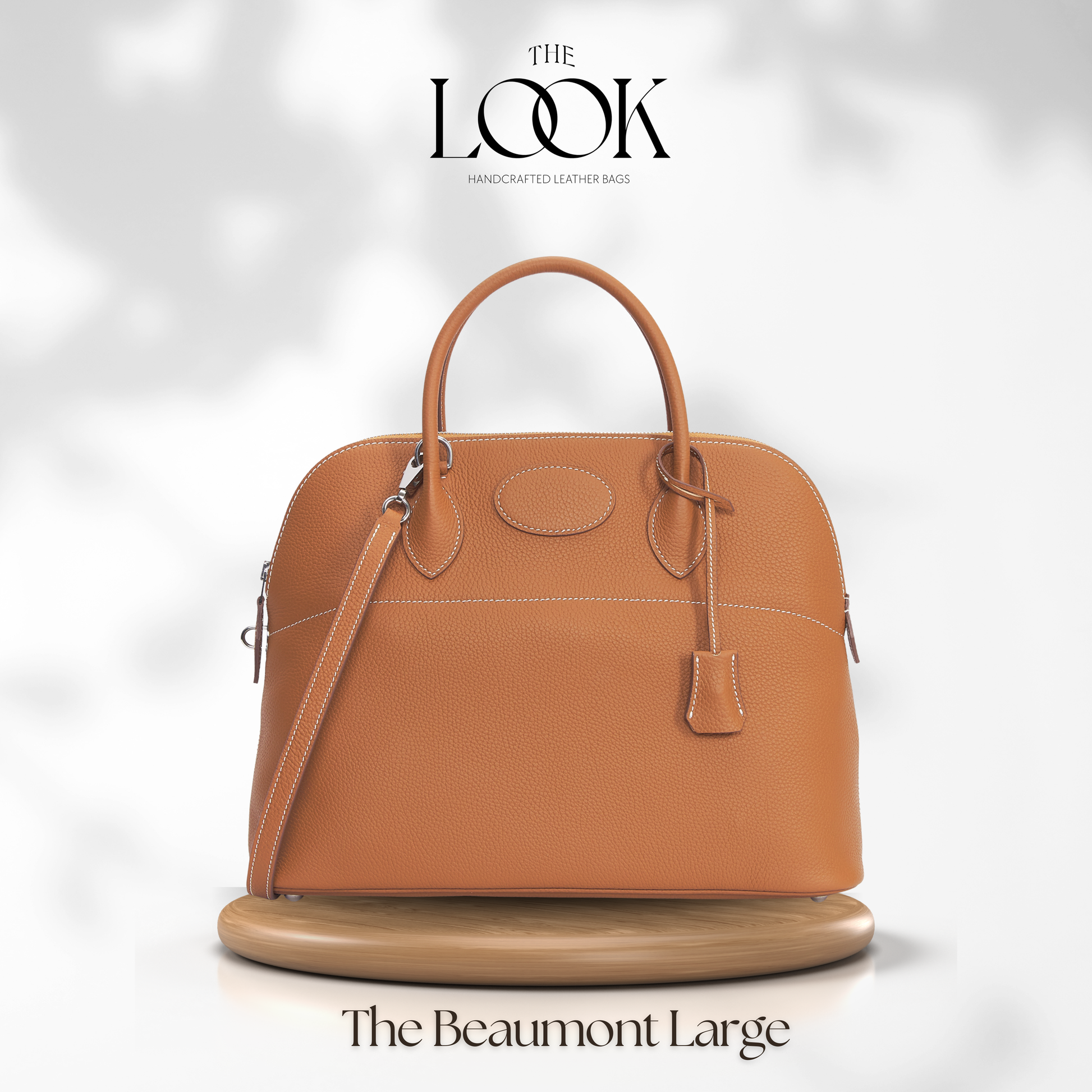 Brown handbag labeled 'The Beaumont Large' on a white background with 'The Look' branding. | The Look Officiel