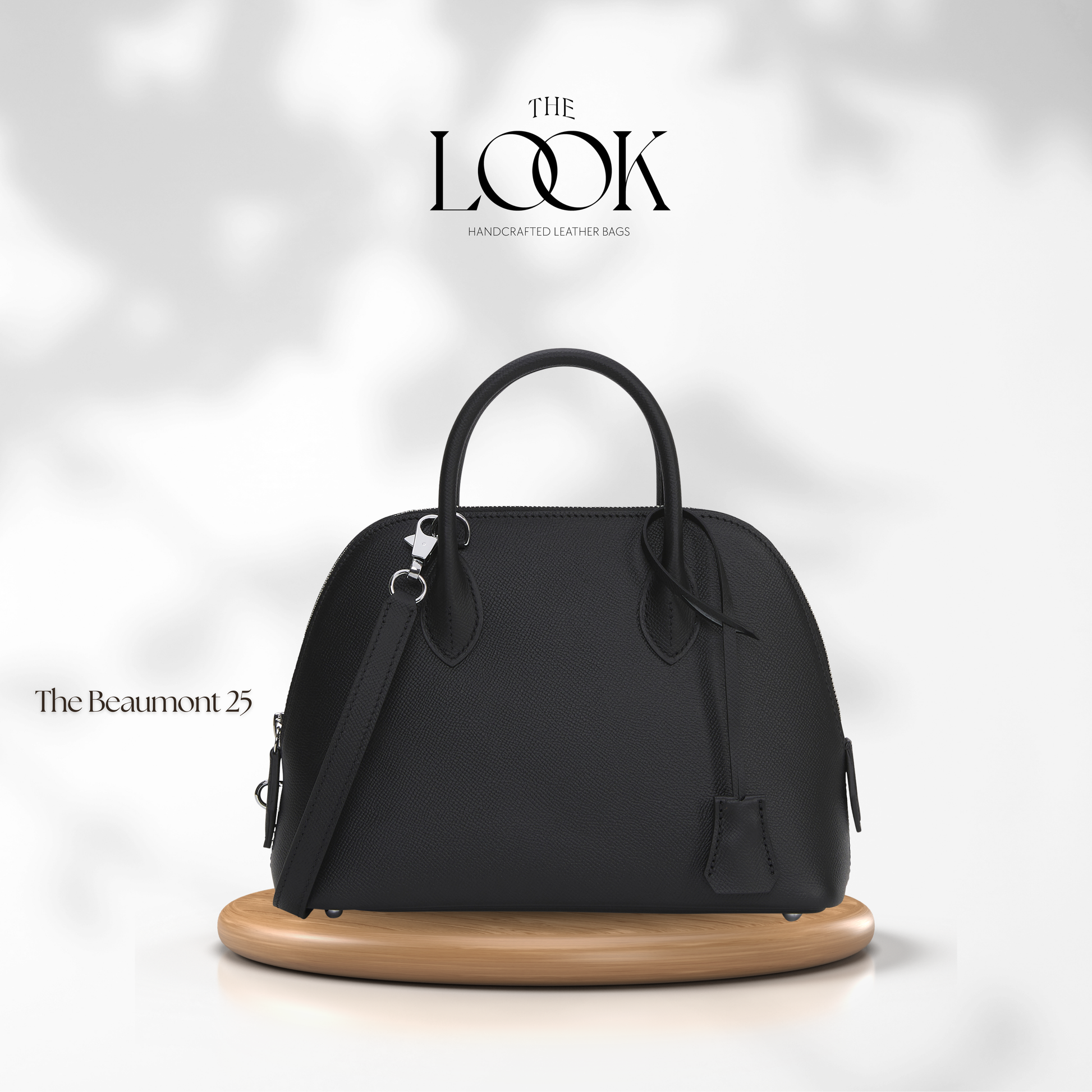 Black handbag on a wooden stand with 'The Look' branding on a white background | The Look Officiel