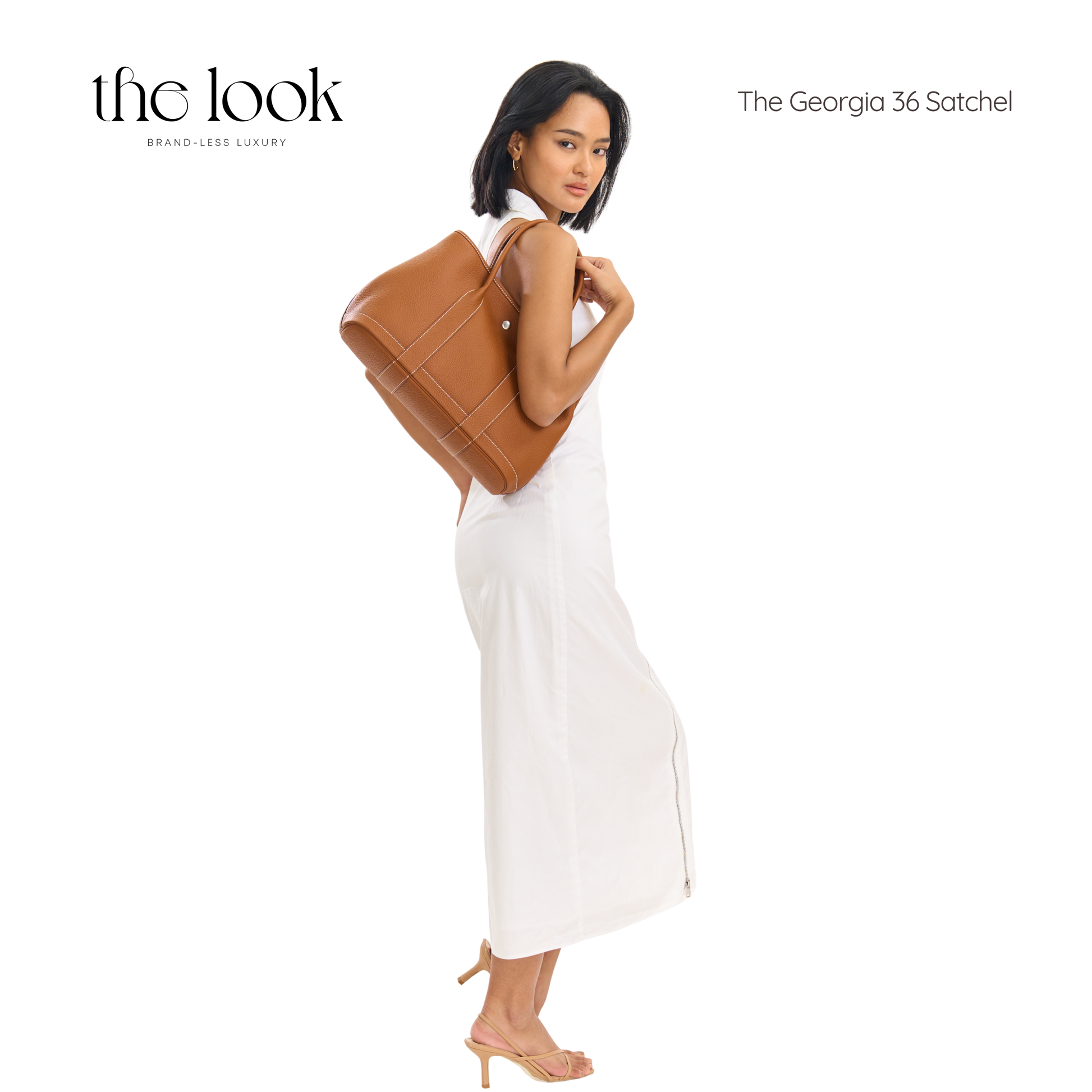 Woman holding a brown satchel with 'the look' branding on a white background | The Look Officiel