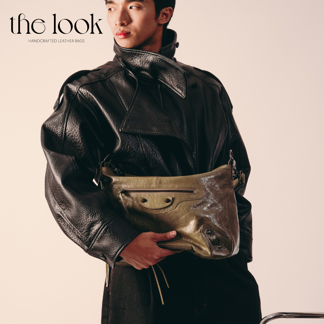 model holding Biker Convertible shoulder bag olive goatskin handle front view
