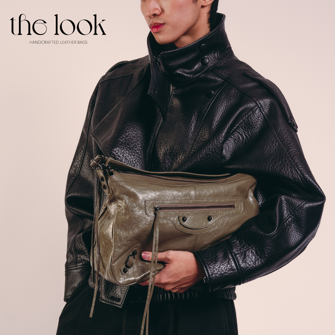 model holding Biker Convertible shoulder bag olive goatskin handle front view