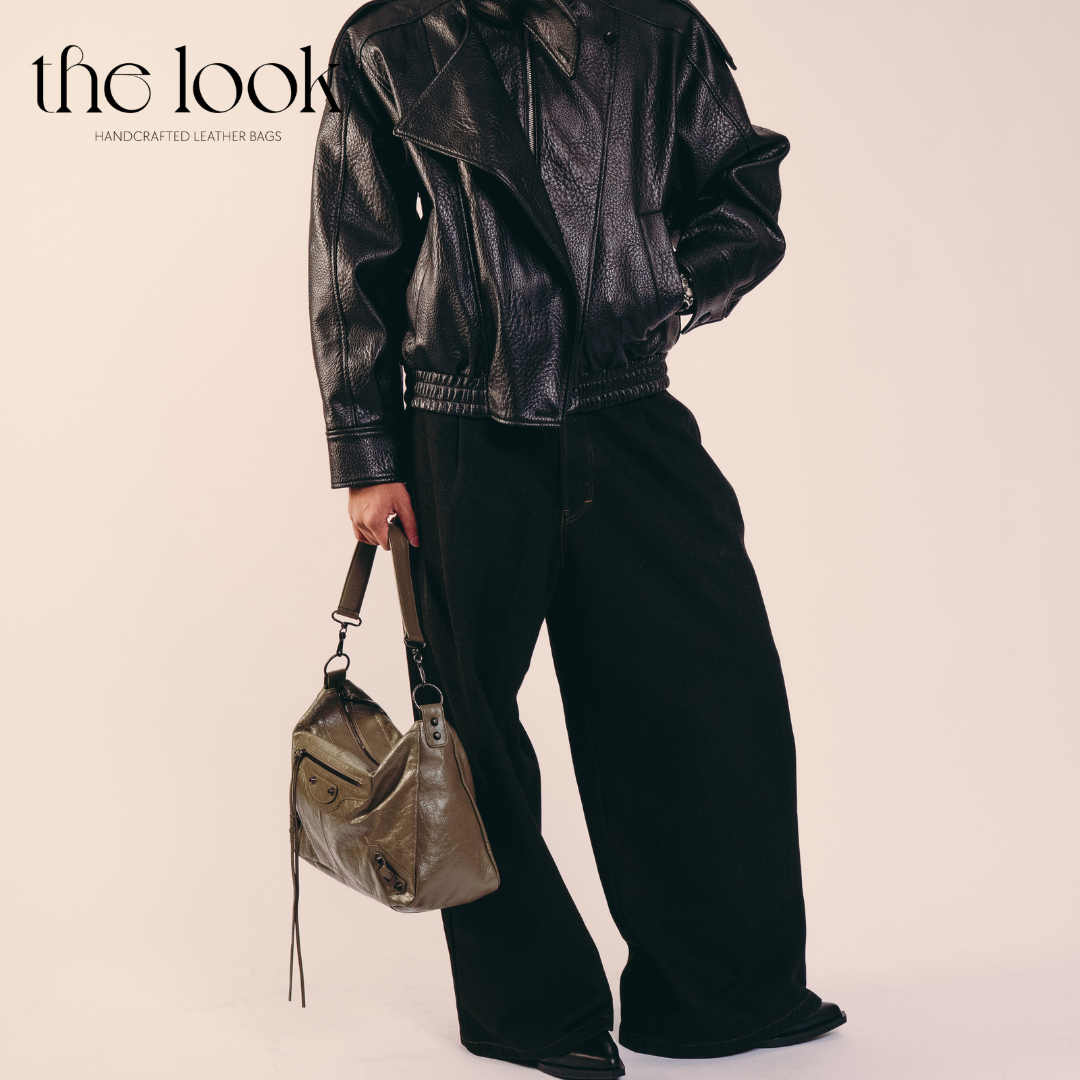 model holding Biker Convertible shoulder bag olive goatskin handle side view