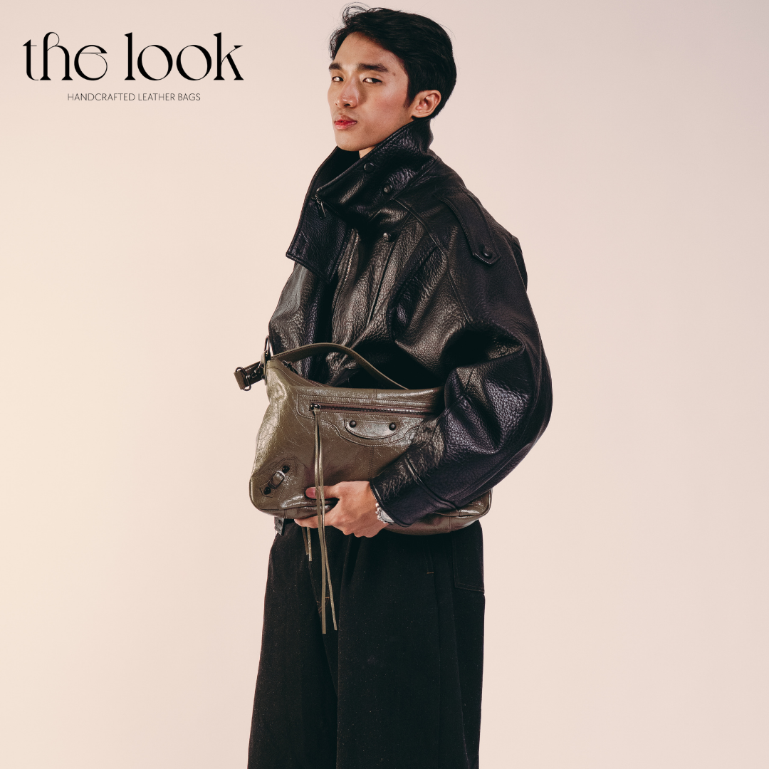 model holding Biker Convertible shoulder bag olive goatskin handle front view