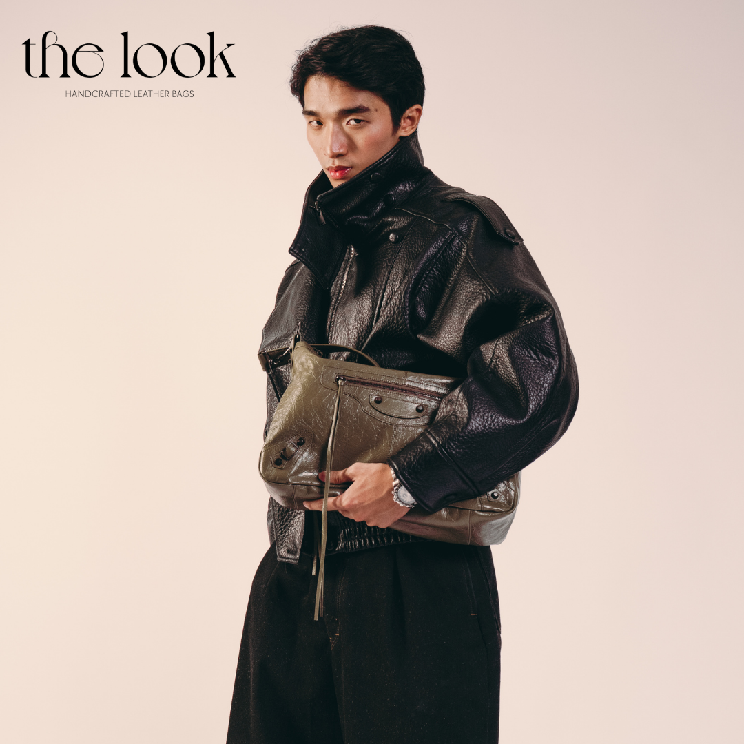 model holding Biker Convertible shoulder bag olive goatskin handle front view
