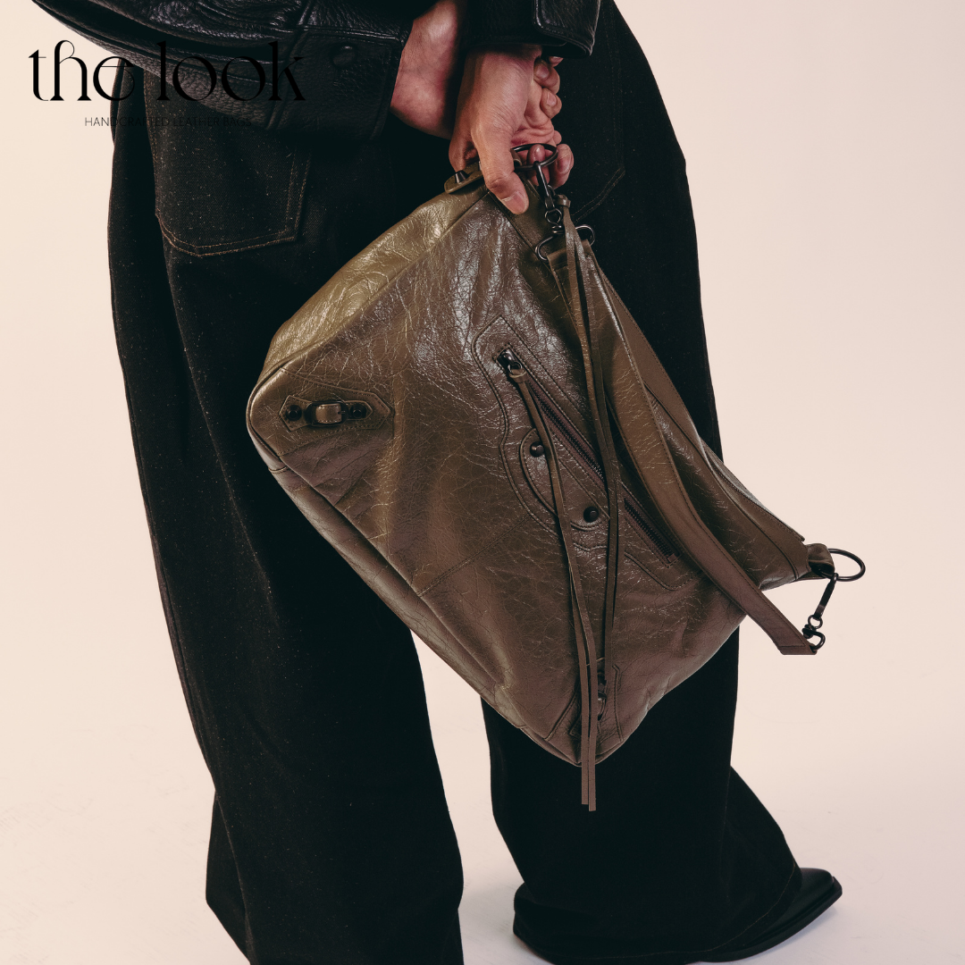 model holding Biker Convertible shoulder bag olive goatskin handle front view