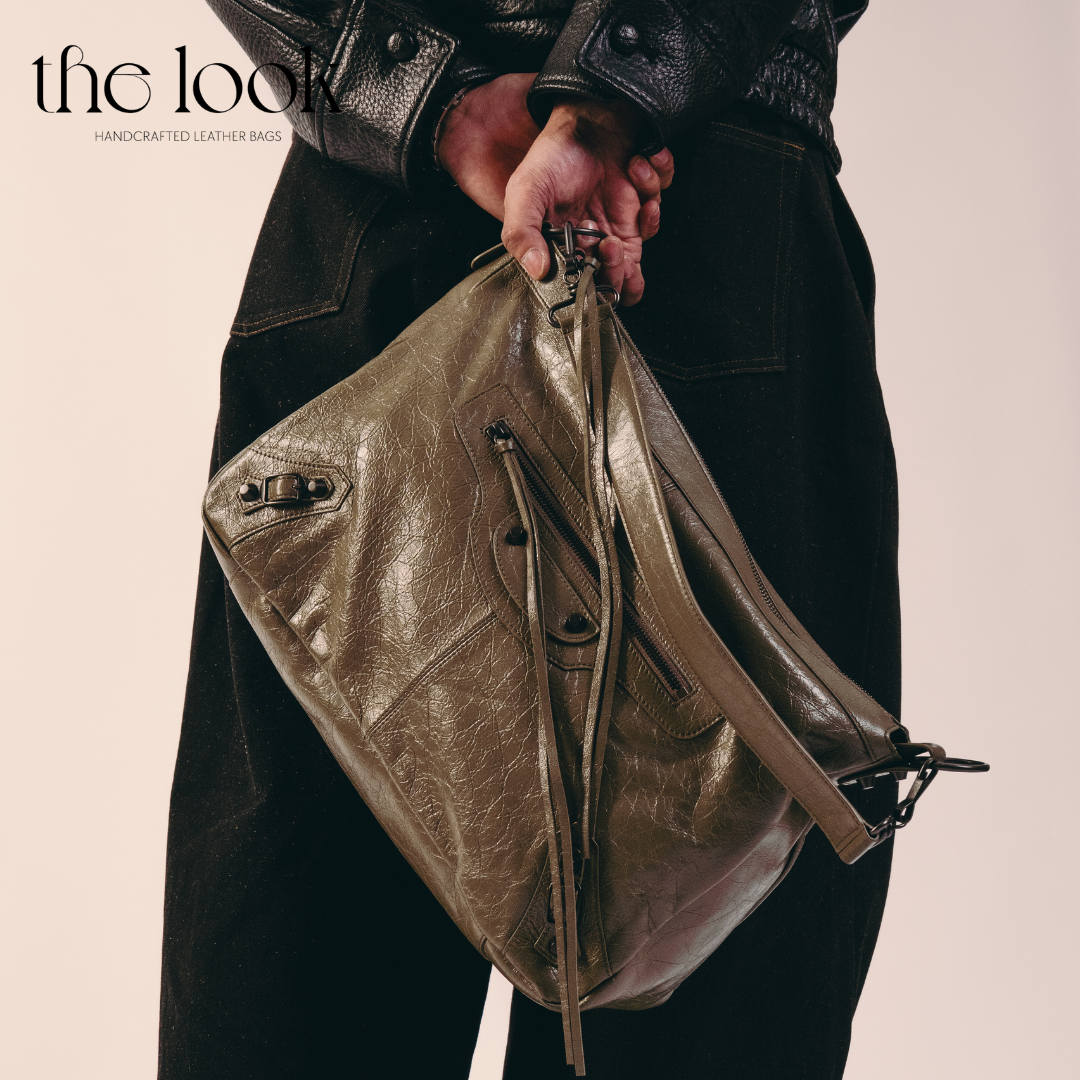 model holding Biker Convertible shoulder bag olive goatskin handle front view