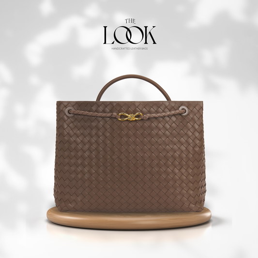 The Loop Jumbo Satchel in Pinecone full-grain woven lambskin leather with top handle and gold hardware.