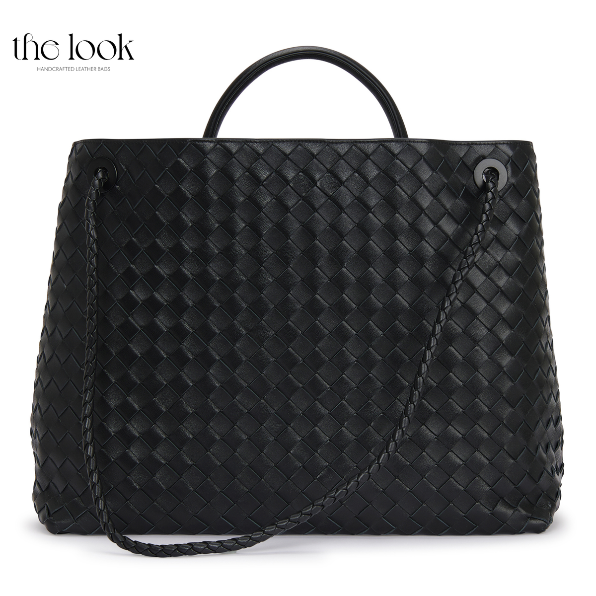 Back view of The Loop Jumbo Satchel in Black woven lambskin leather with top handle and additional strap.