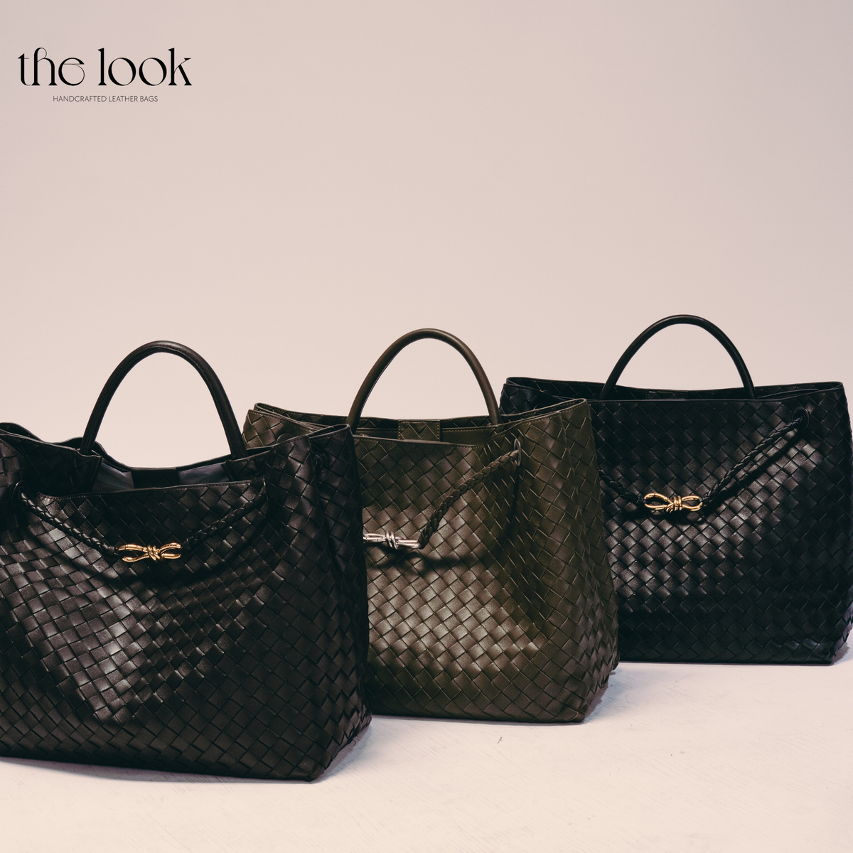 The Loop Jumbo Satchel displayed in multiple colors, highlighting the woven leather construction, top handles and hardware options.