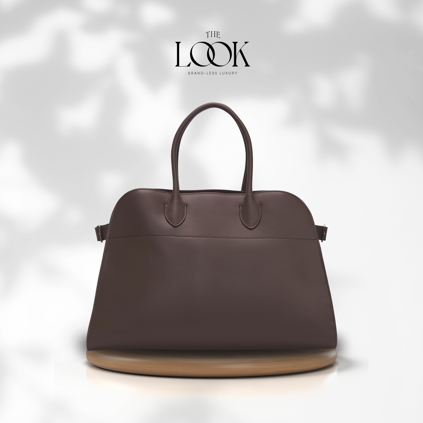 Brown handbag on a white background with 'The Look' brand logo. | The Look Officiel