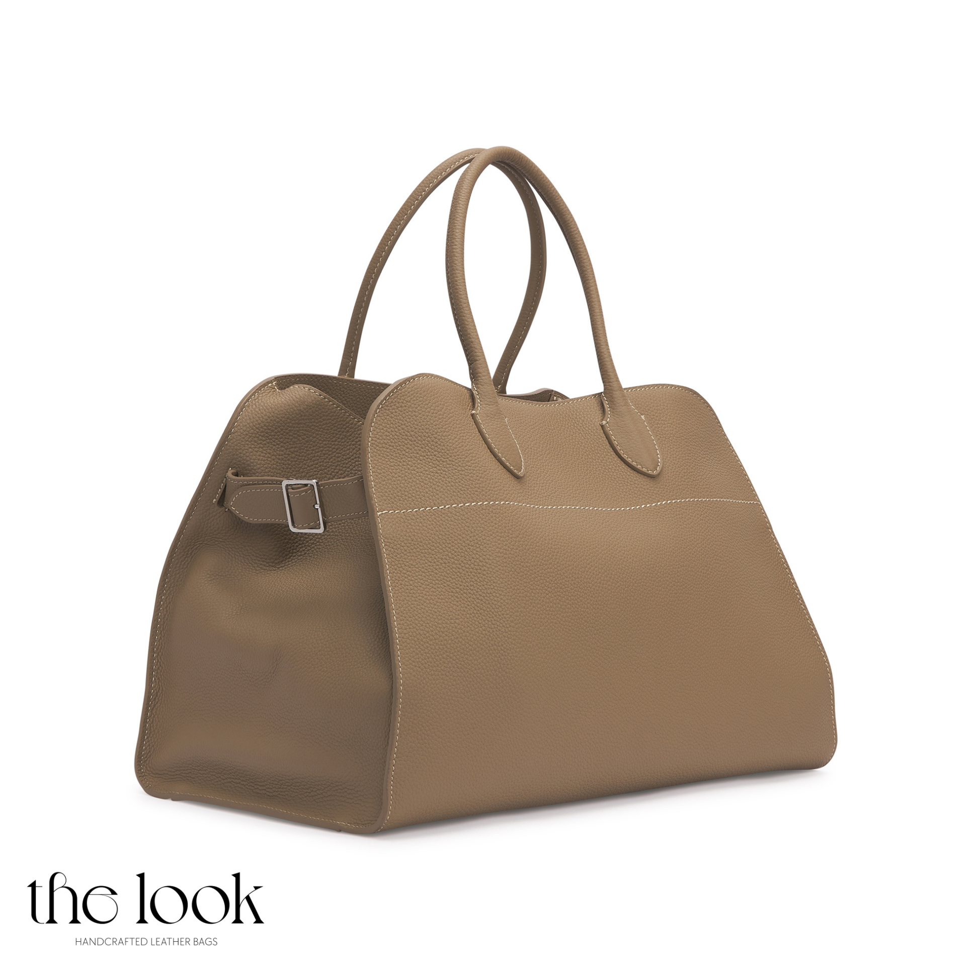 Brown leather handbag on a white background with 'the look' branding. | The Look Officiel