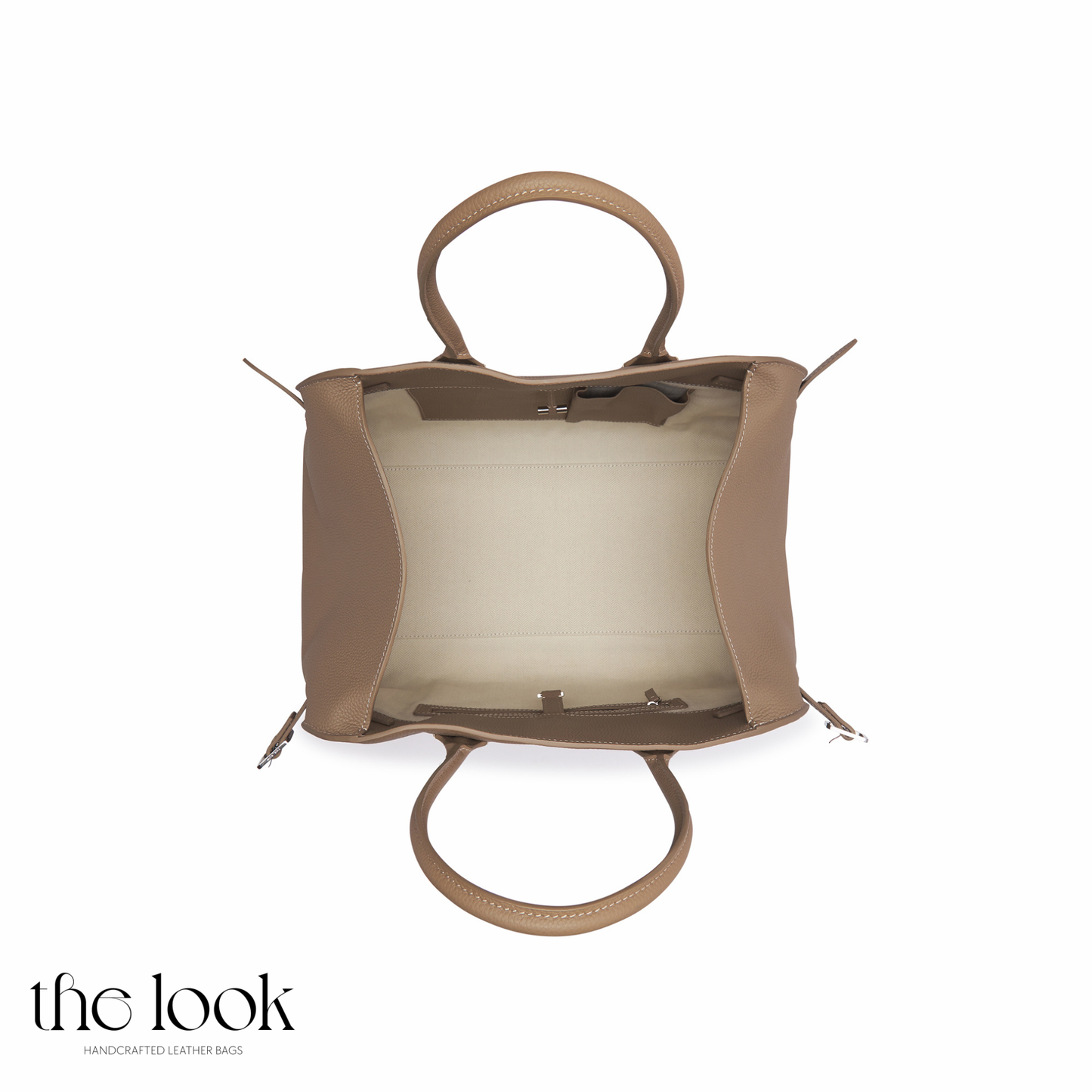 Tan leather handbag with a white background | The Look Officiel