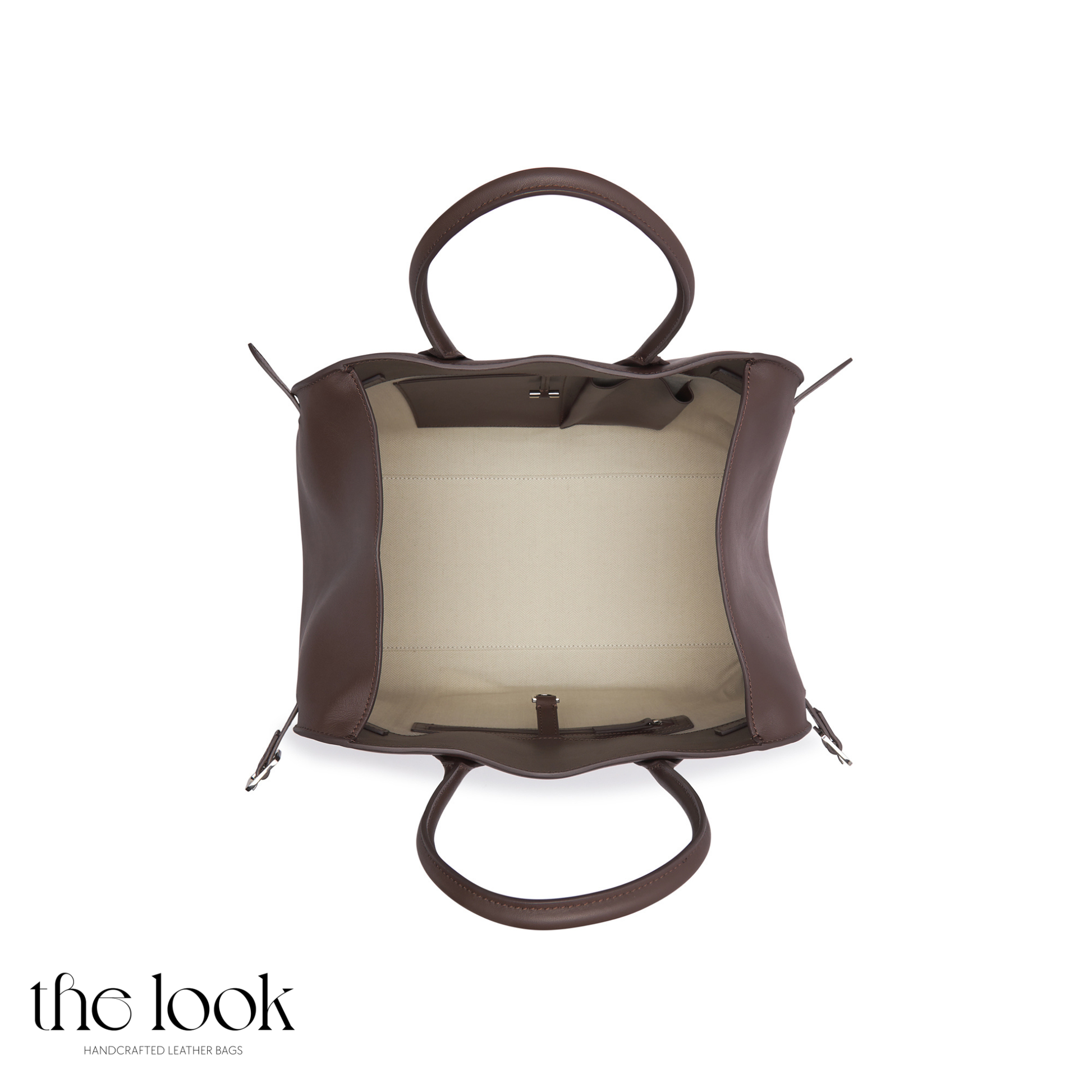 Brown leather handbag with a sheer panel on a white background, featuring 'the look' brand. | The Look Officiel