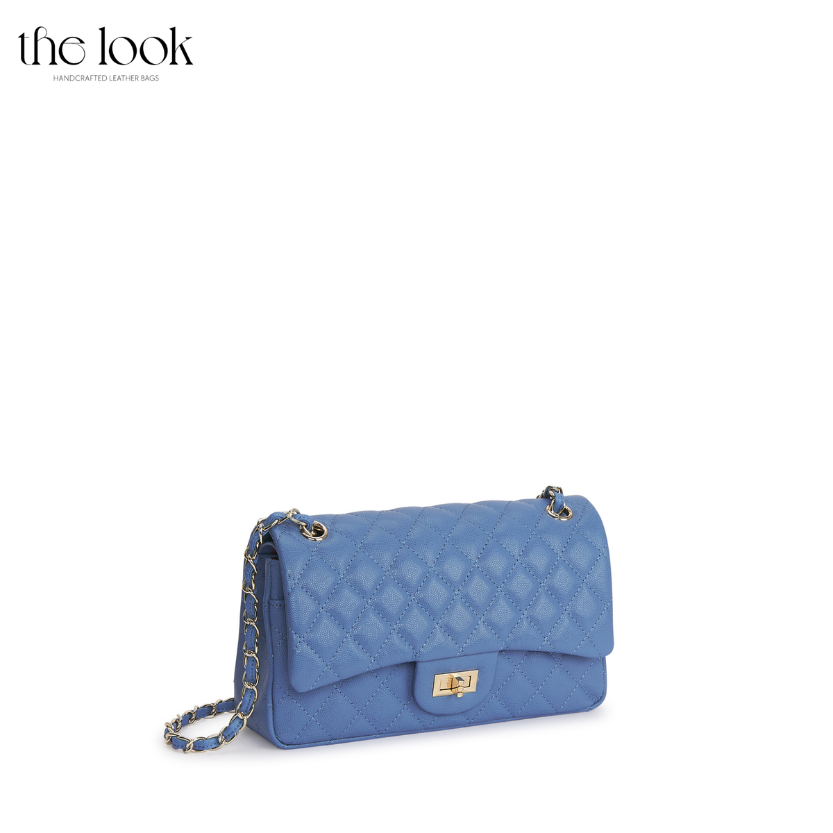 The Quilte Medium Convertible Shoulder Bag in cornflower blue caviar calfskin leather with silver hardware, angled front view | The Look Officiel
