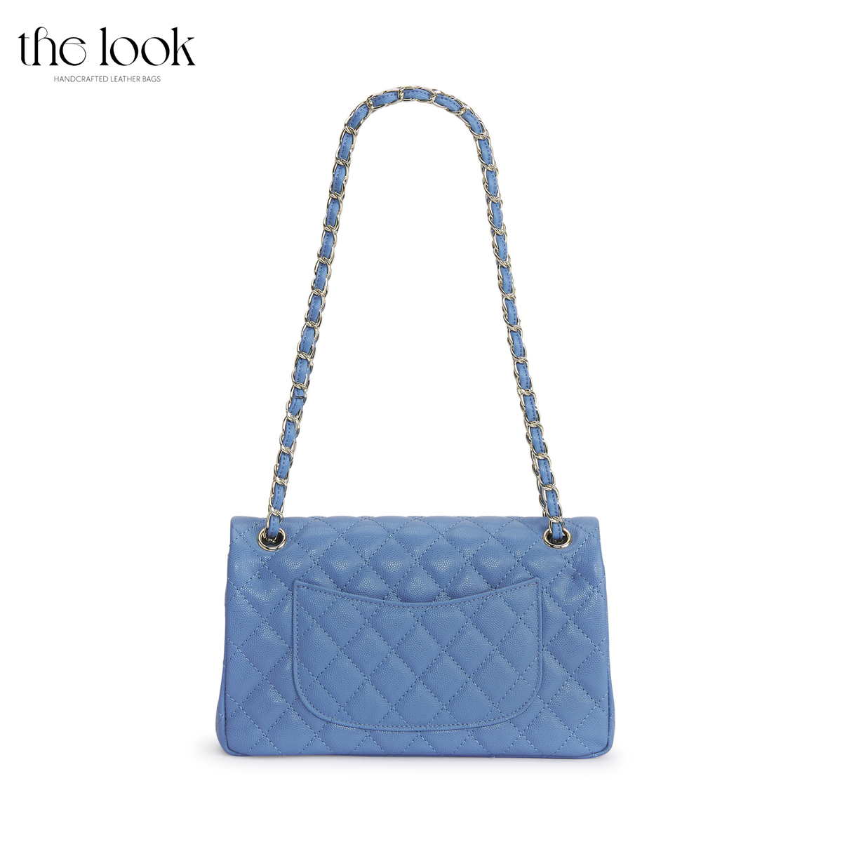 The Quilte Medium Convertible Shoulder Bag in cornflower blue caviar calfskin leather with silver hardware, back view with chain strap and exterior slip pocket | The Look Officiel