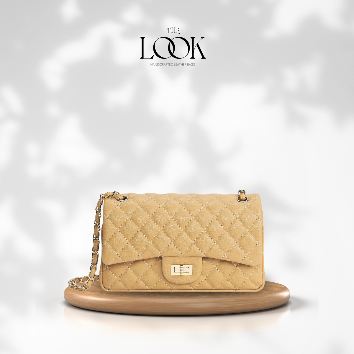 The Quilte Medium Convertible Shoulder Bag in biscuit caviar calfskin leather with silver hardware, front view | The Look Officiel