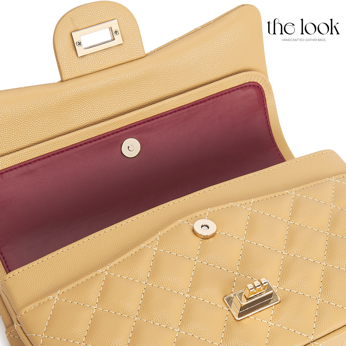 The Quilte Medium Convertible Shoulder Bag in biscuit caviar calfskin leather with champagne gold hardware, double-flap interior close-up view | The Look Officiel