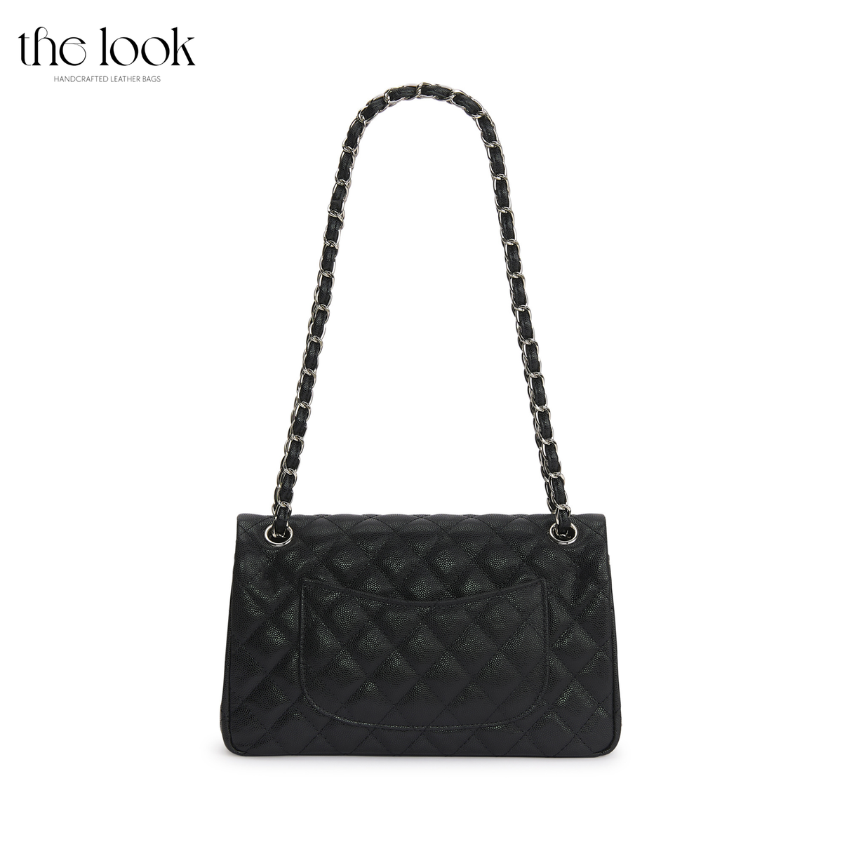 The Quilte Medium Convertible Shoulder Bag in black caviar calfskin leather with silver hardware, back view with chain strap and exterior slip pocket | The Look Officiel