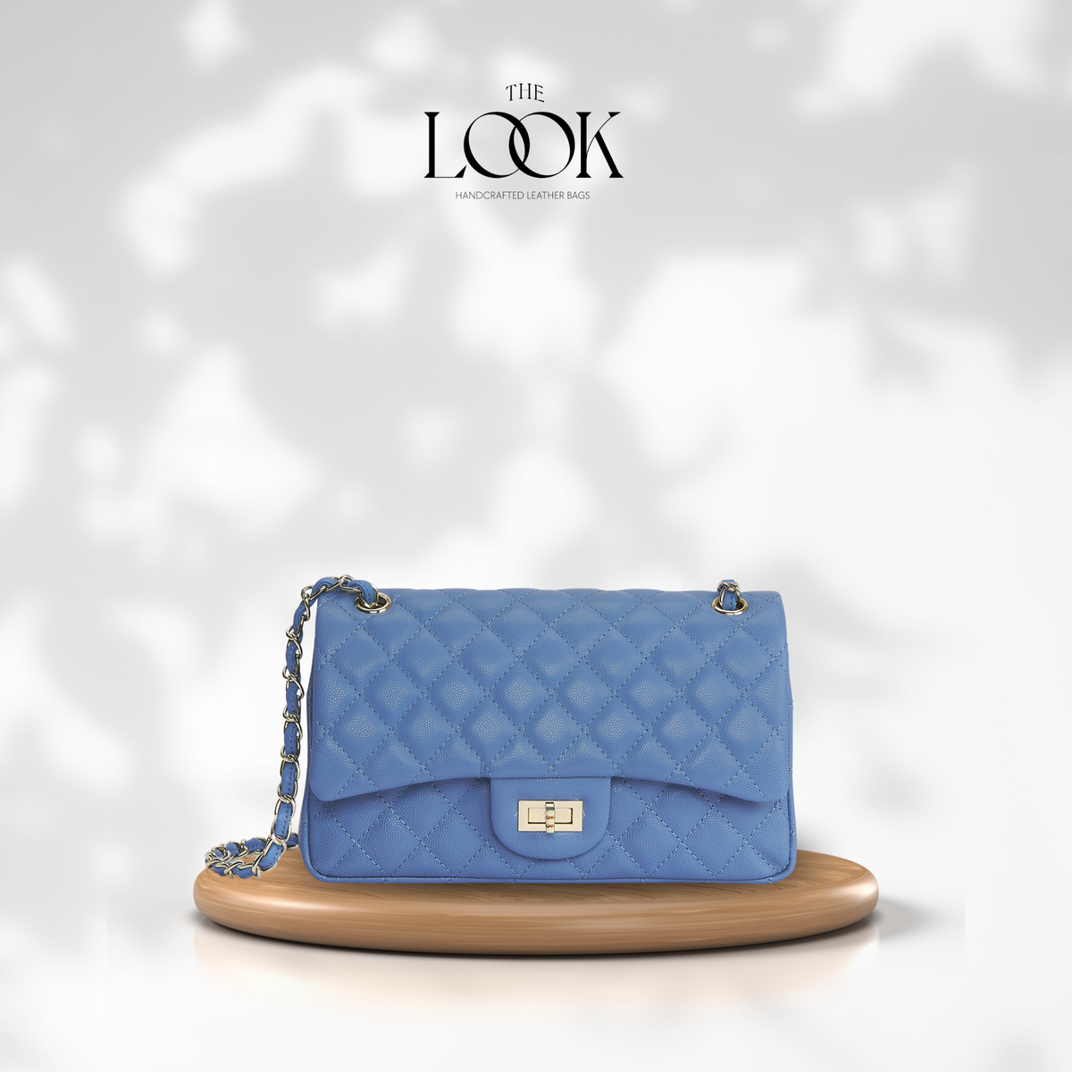 The Quilte Medium Convertible Shoulder Bag in cornflower blue caviar calfskin leather with silver hardware, front view | The Look Officiel