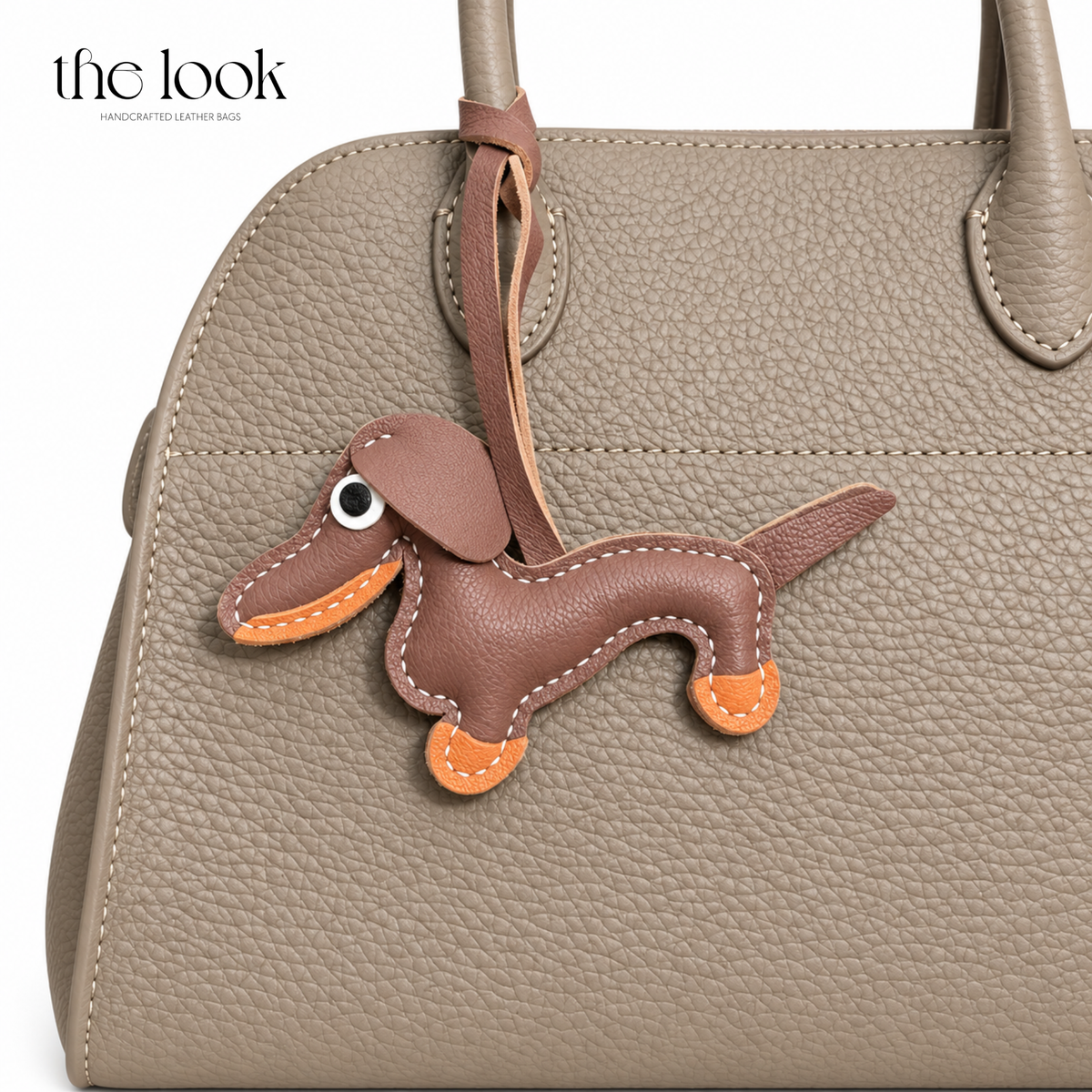 Quirky the Brown Dachshund dog bag charm styled on a taupe handbag | The Look Officiel