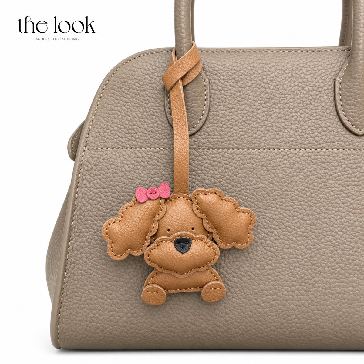 Gigi the Caramel Poodle dog bag charm styled on a taupe handbag | The Look Officiel