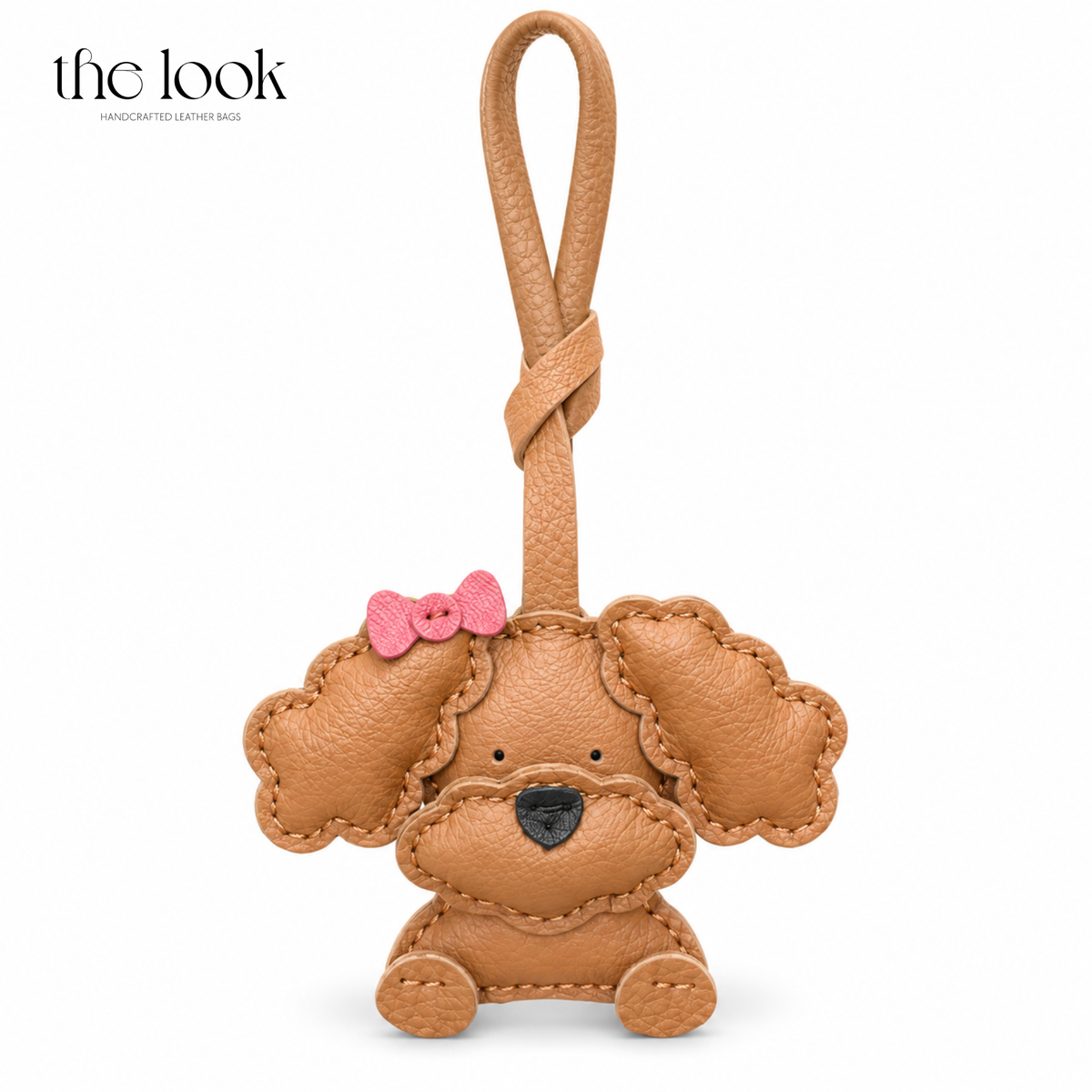 Gigi the Caramel Poodle caramel dog bag charm with pink bow detail | The Look Officiel