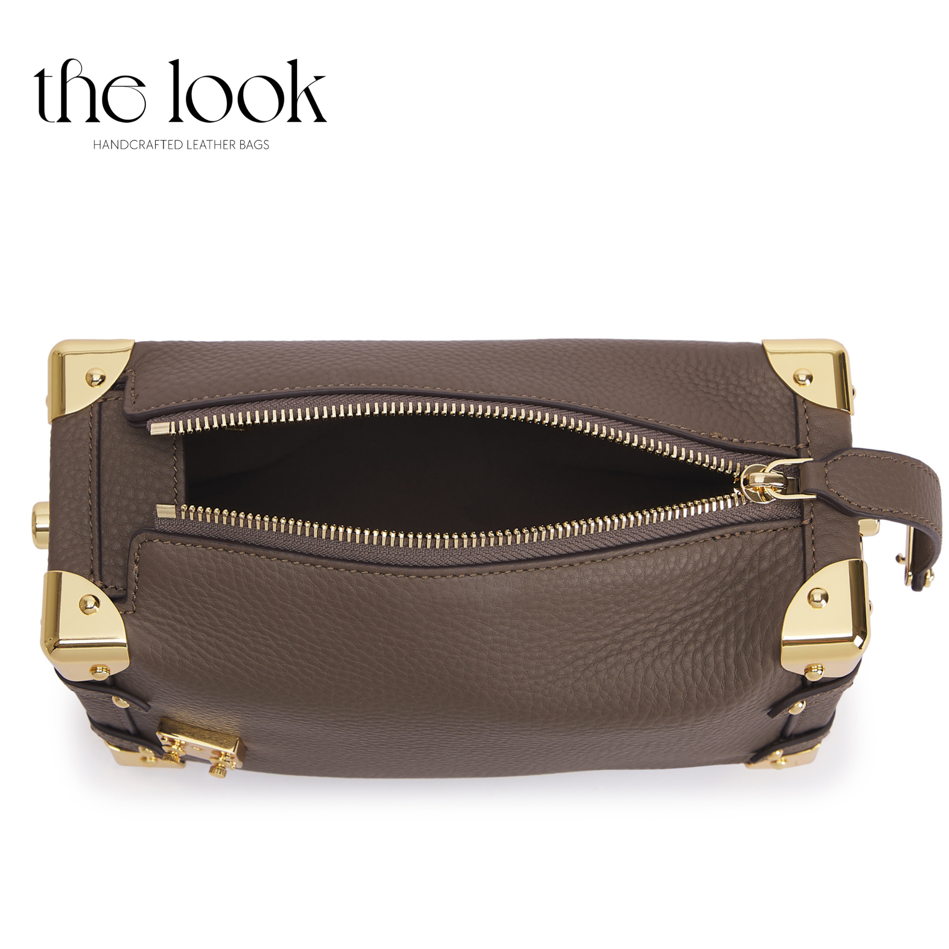 Brown leather handbag with gold accents on a white background, branded 'the look'. | The Look Officiel