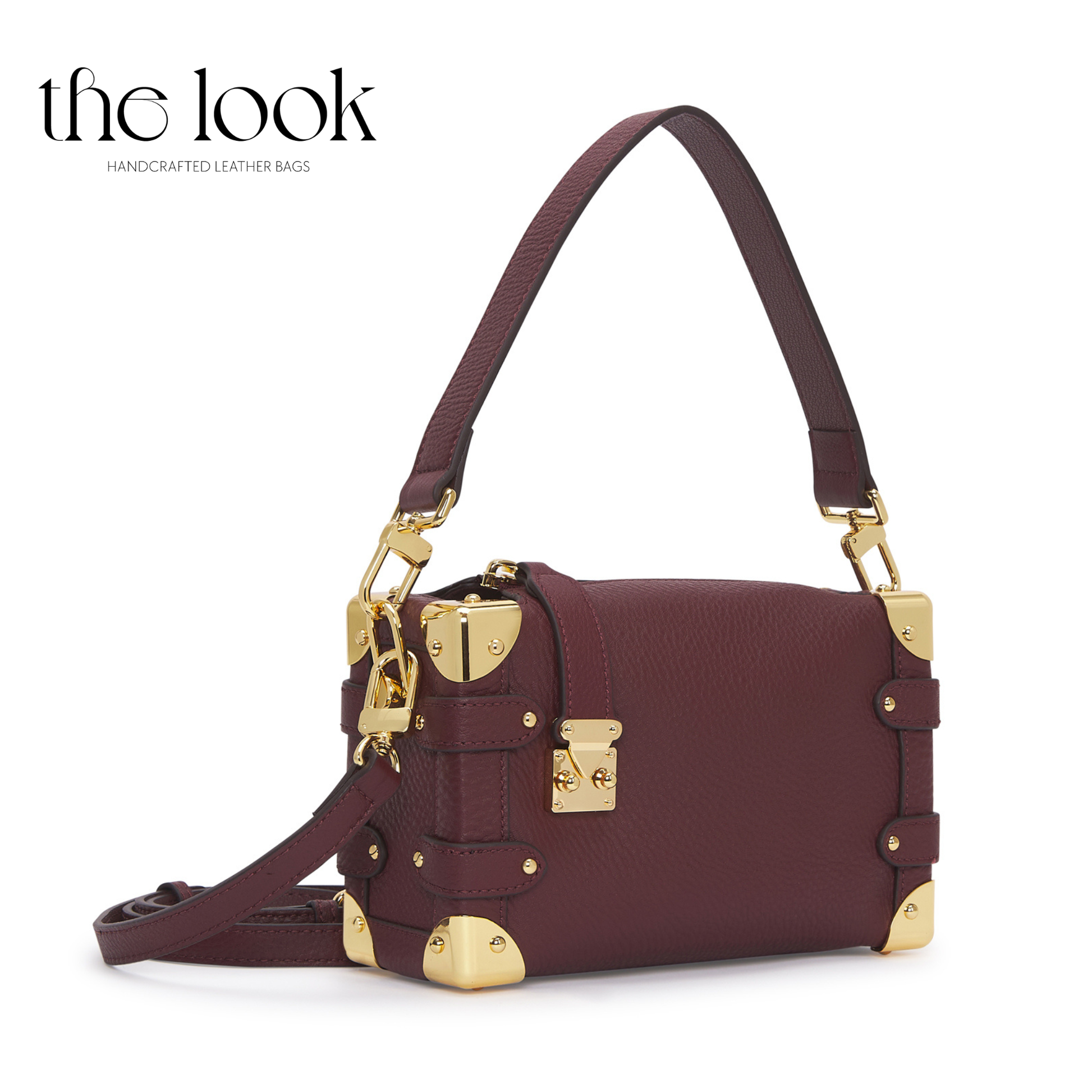 Maroon handbag with gold accents on a white background, branded 'the look'. | The Look Officiel