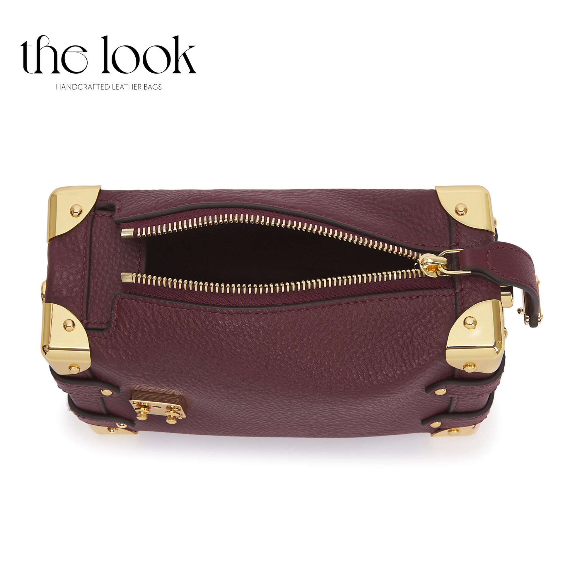 Maroon leather handbag with gold accents on a white background, featuring 'the look' brand. | The Look Officiel